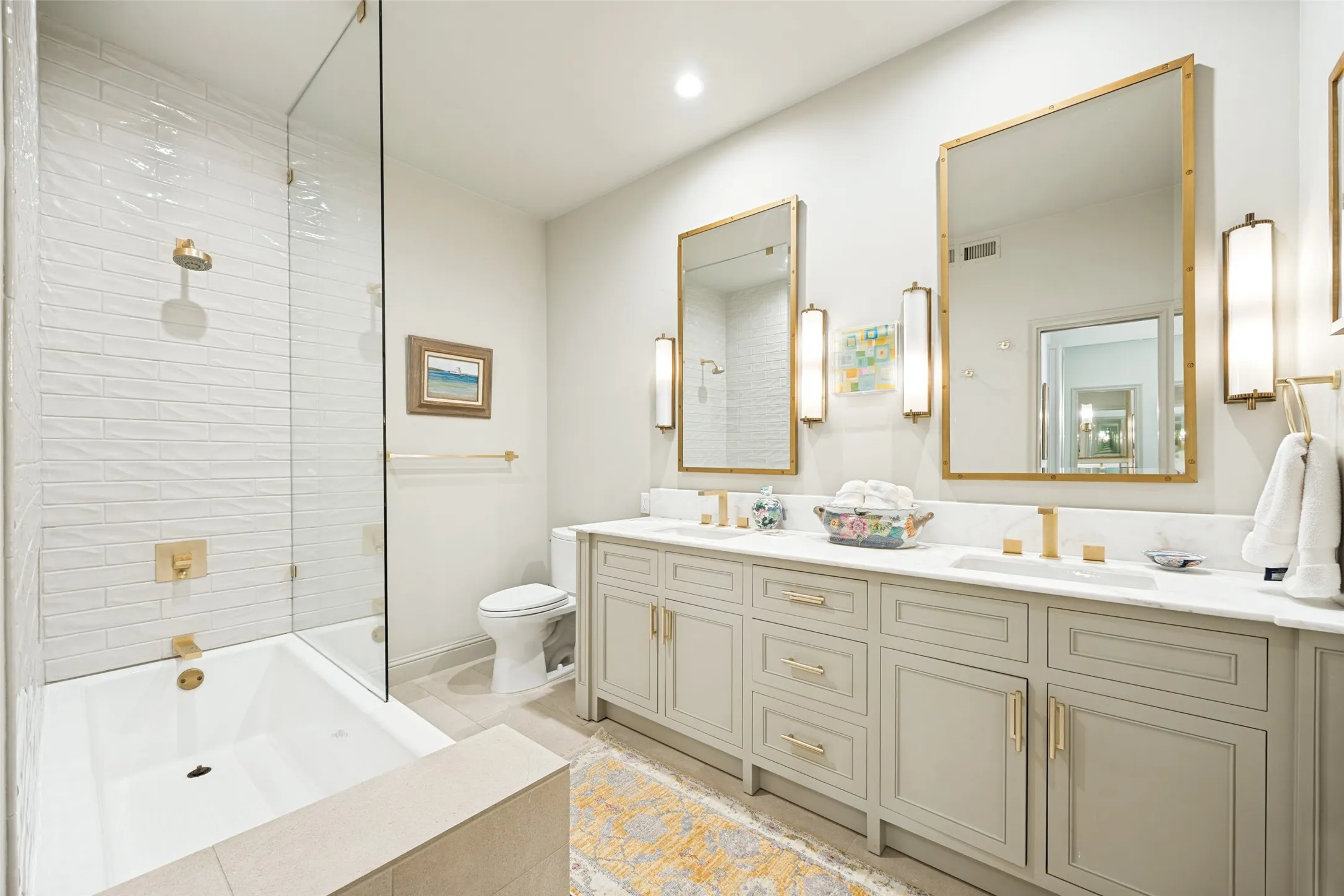 remodeled with designer fixtures, dual sinks, tub- shower