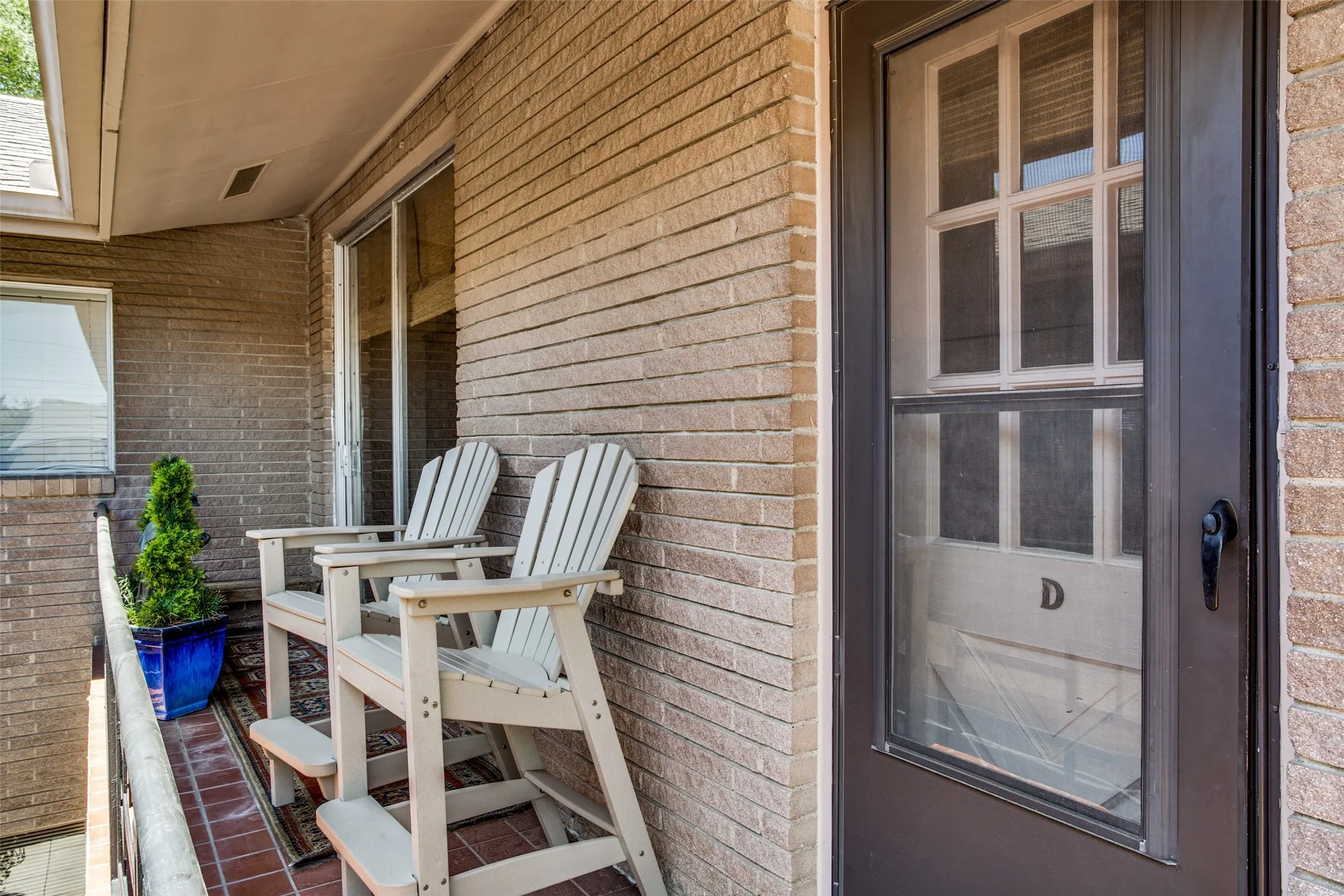 Side balcony overlooking shared courtyard