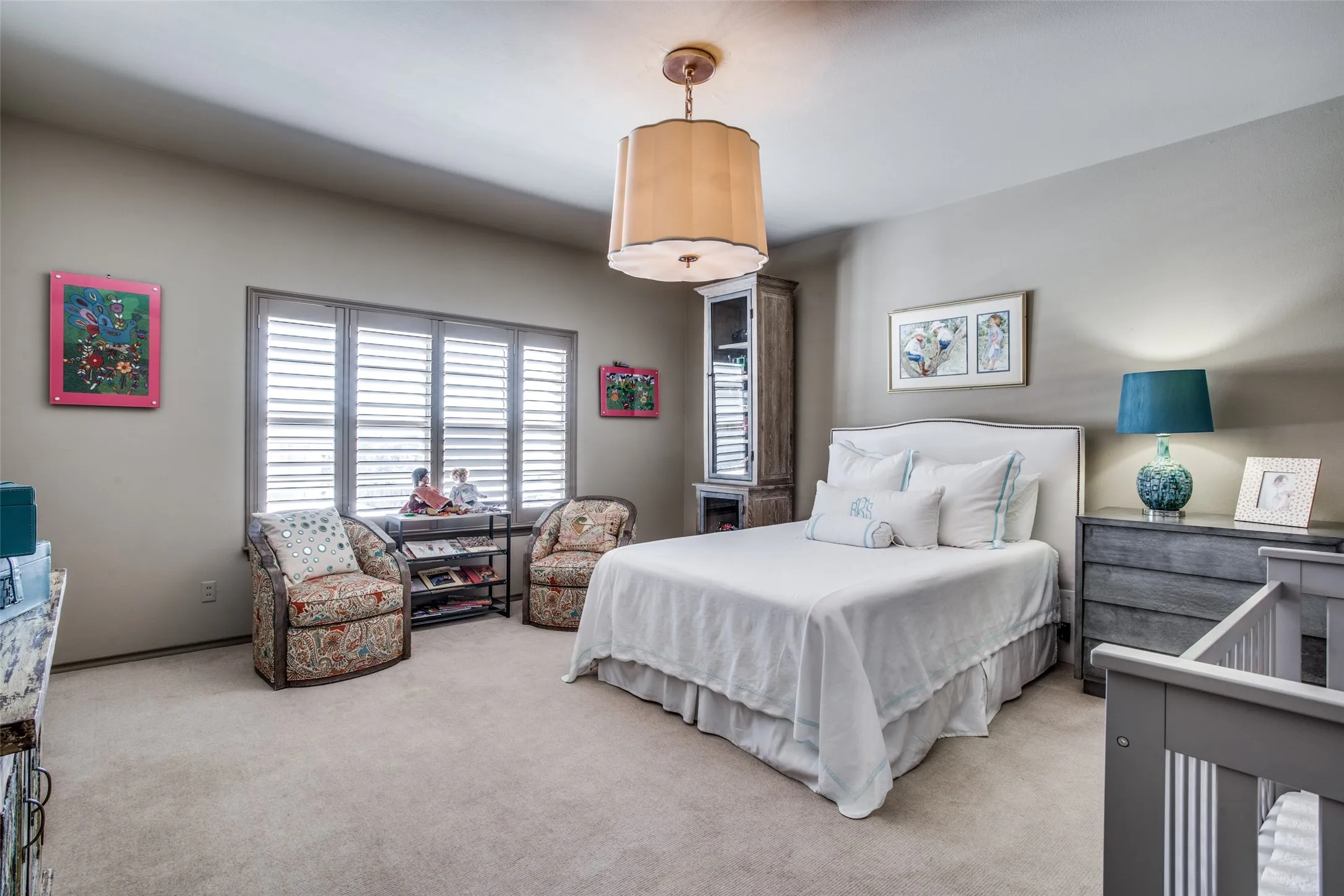 Guest bedroom with Designer chandelier