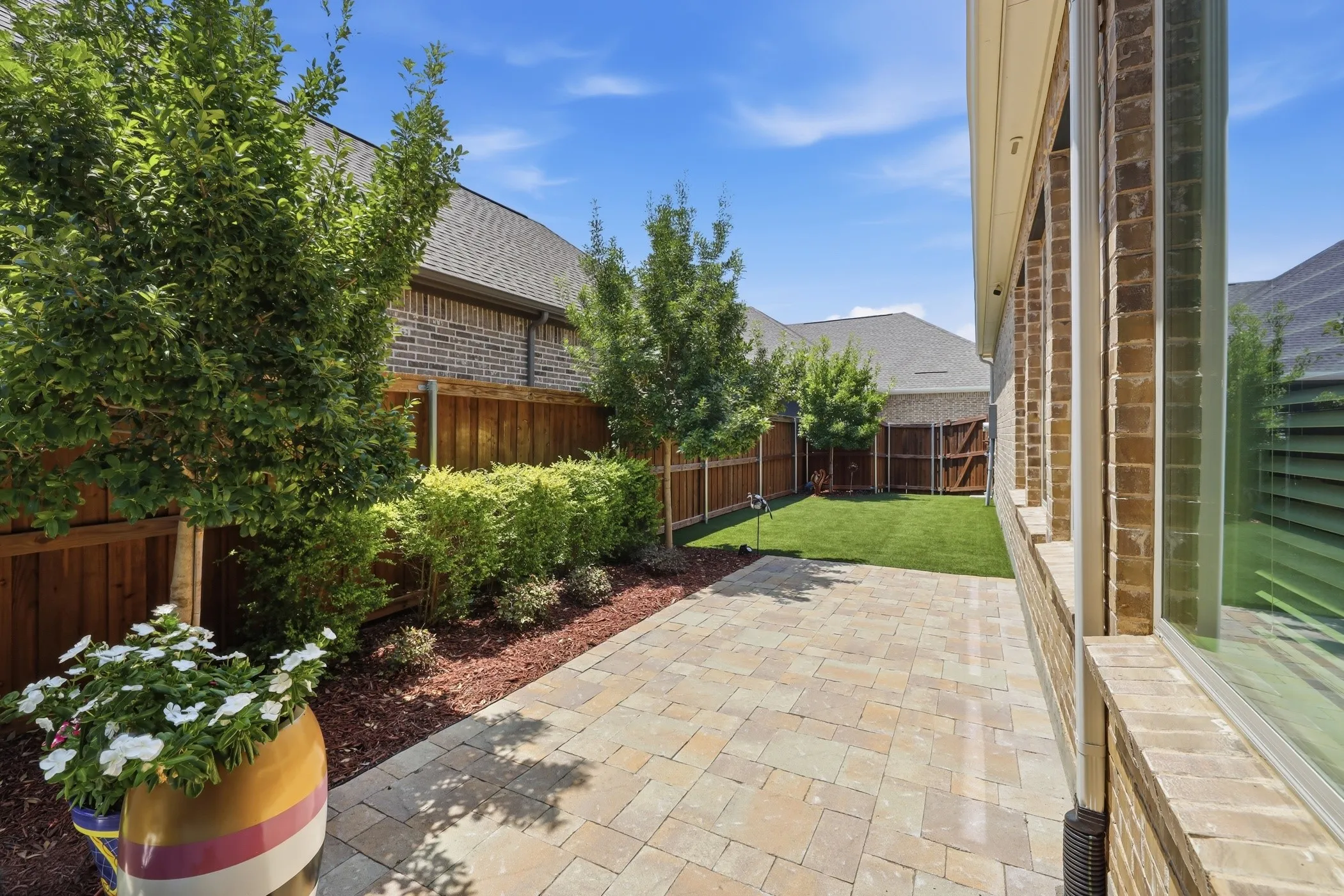 Extended patio and landscaping added.  Backyard is turf for easy maintenance.