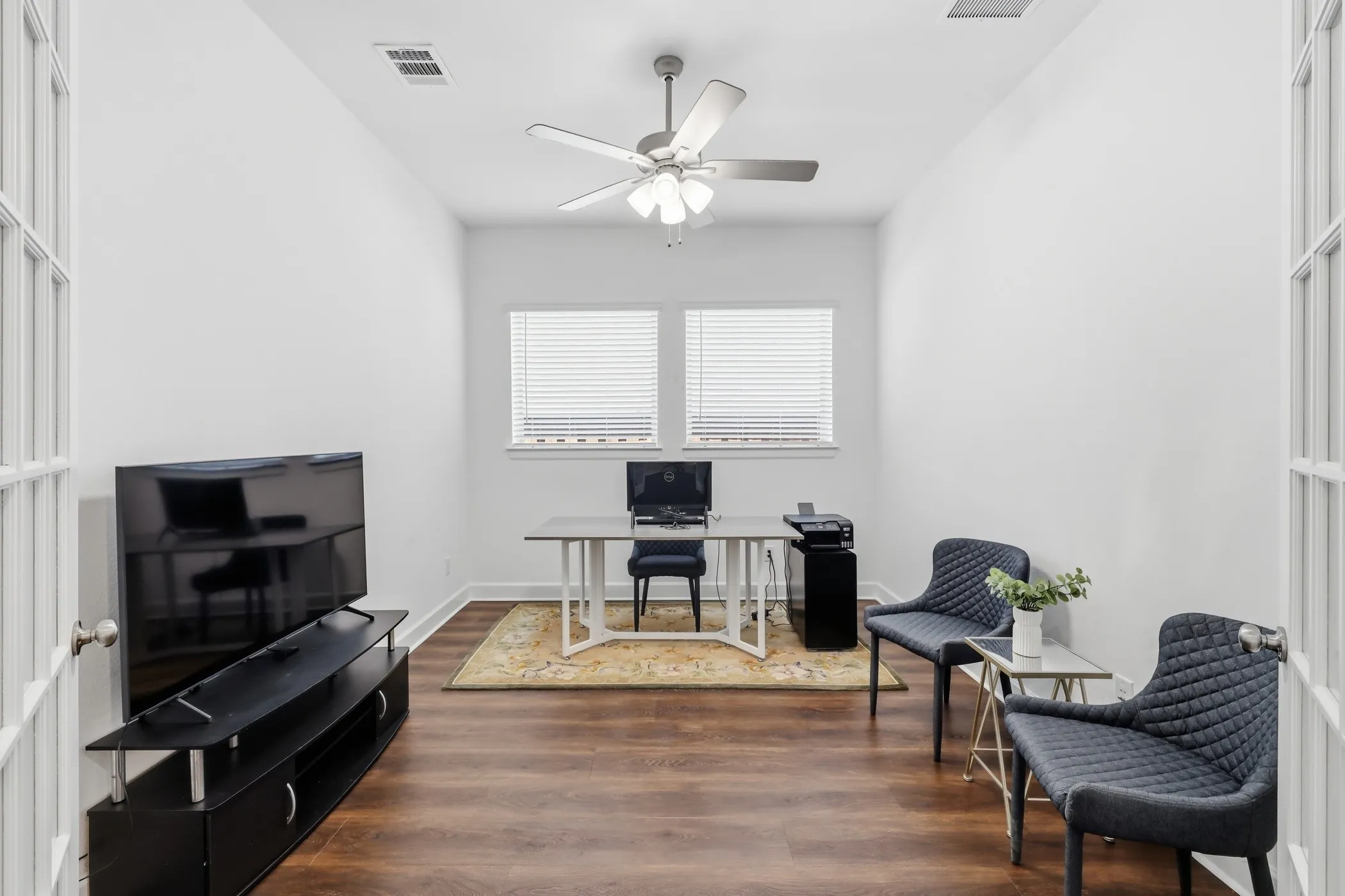 Can be used for an office, second living space or third bedroom.  Fully enclosed room with french doors.