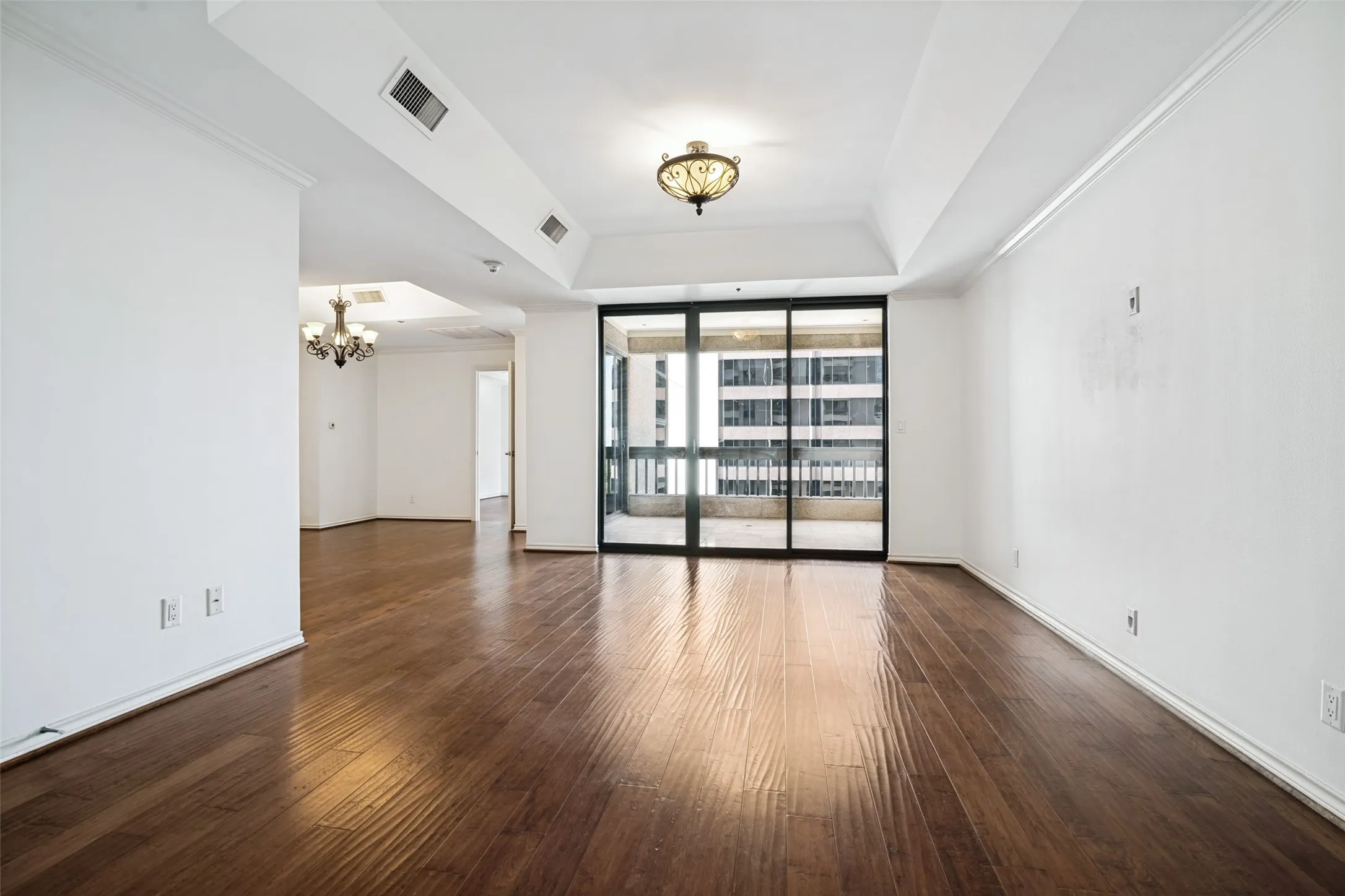 The Shelton Unit 1202 opens up to an expansive living area with plenty of natural light and wood floors. Open concept that walks you through to the balcony or on to the dining area.