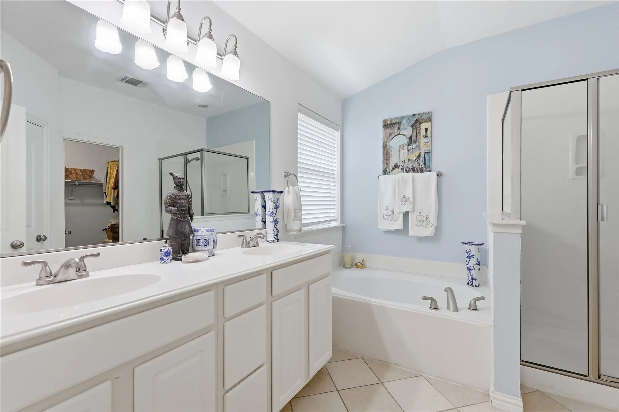 Dual vanity and separate tub and shower