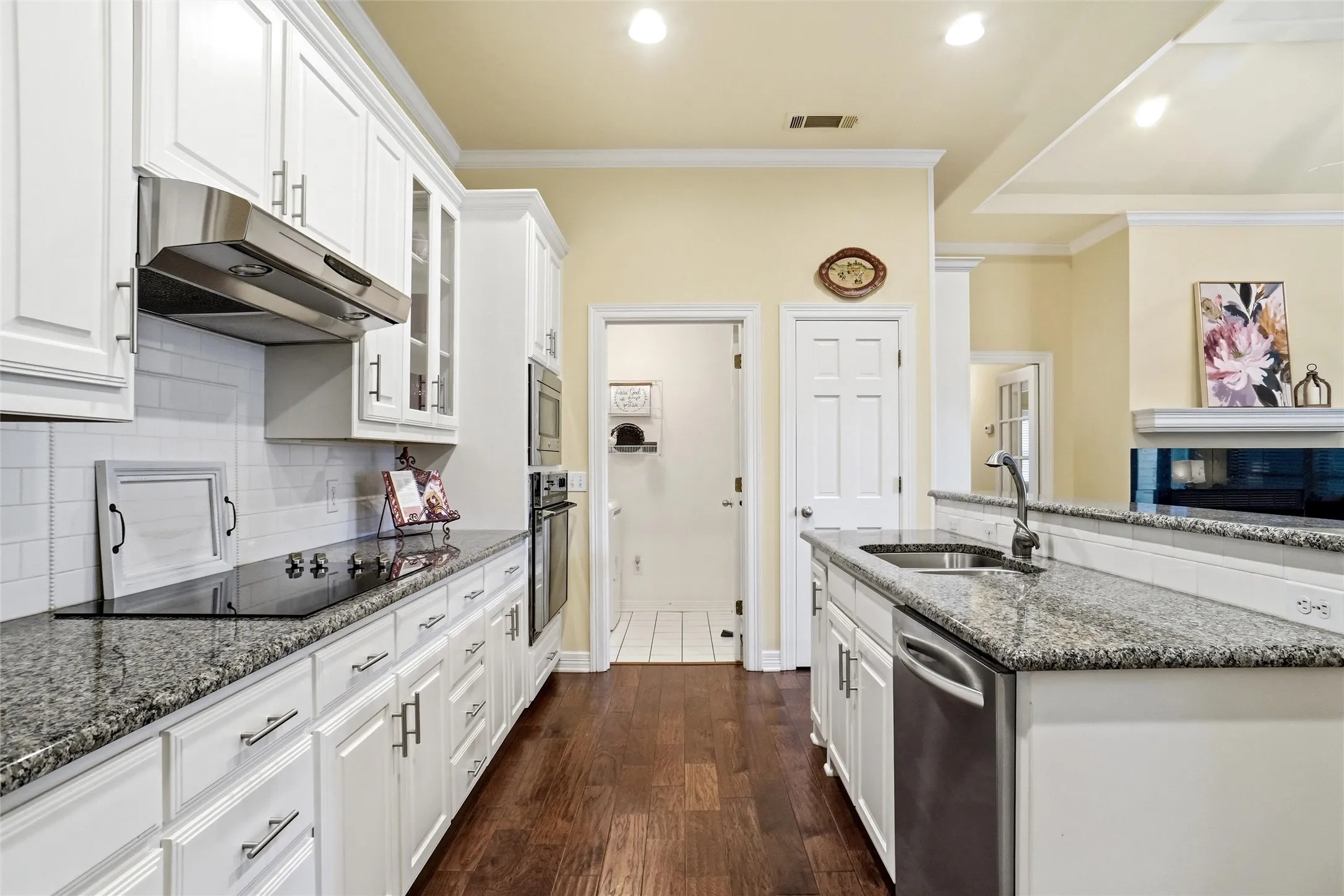 Updated kitchen with utility room at the end. Utility room has additional storage closet.