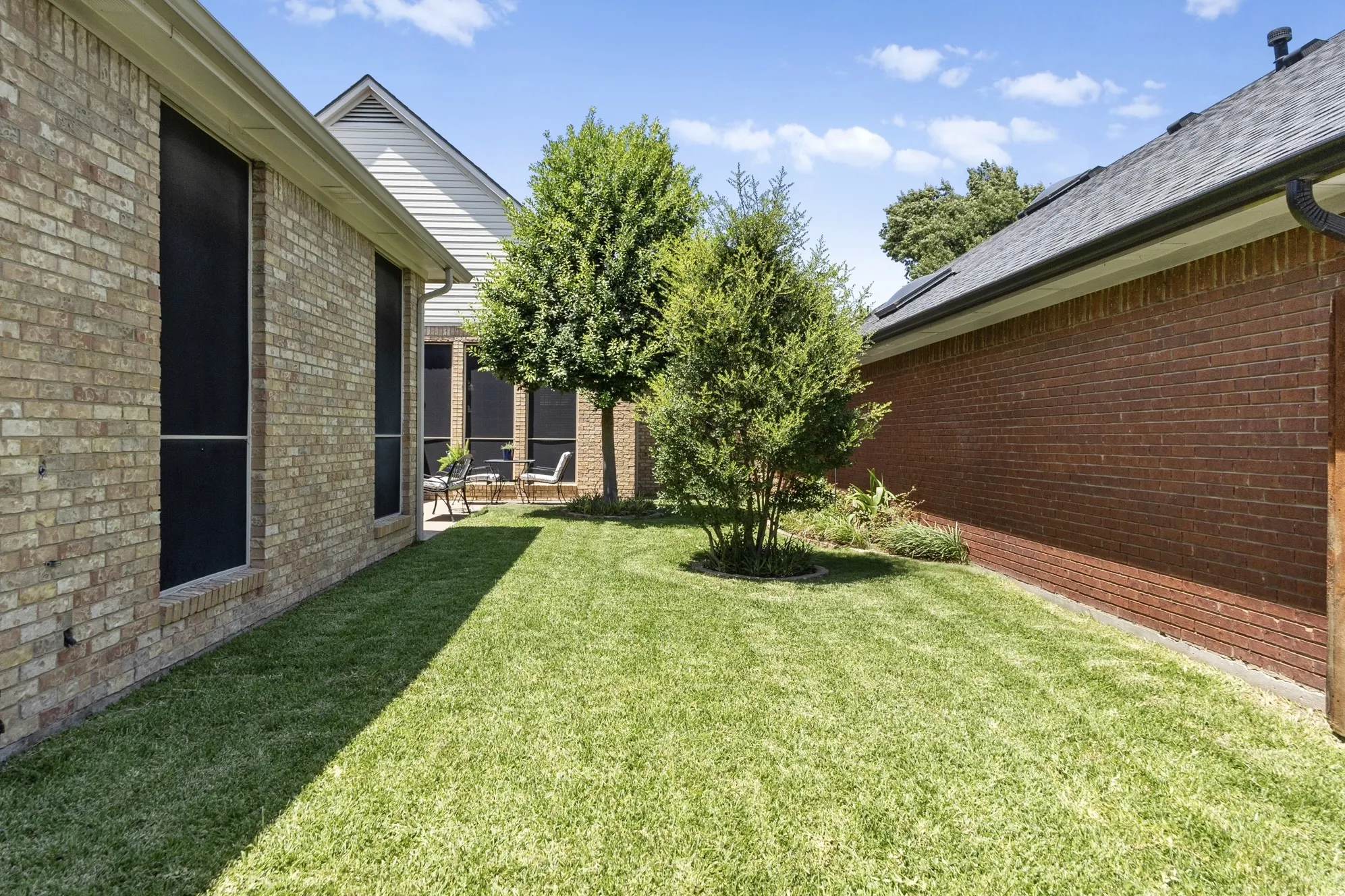 Yard fenced separate from ac unit.