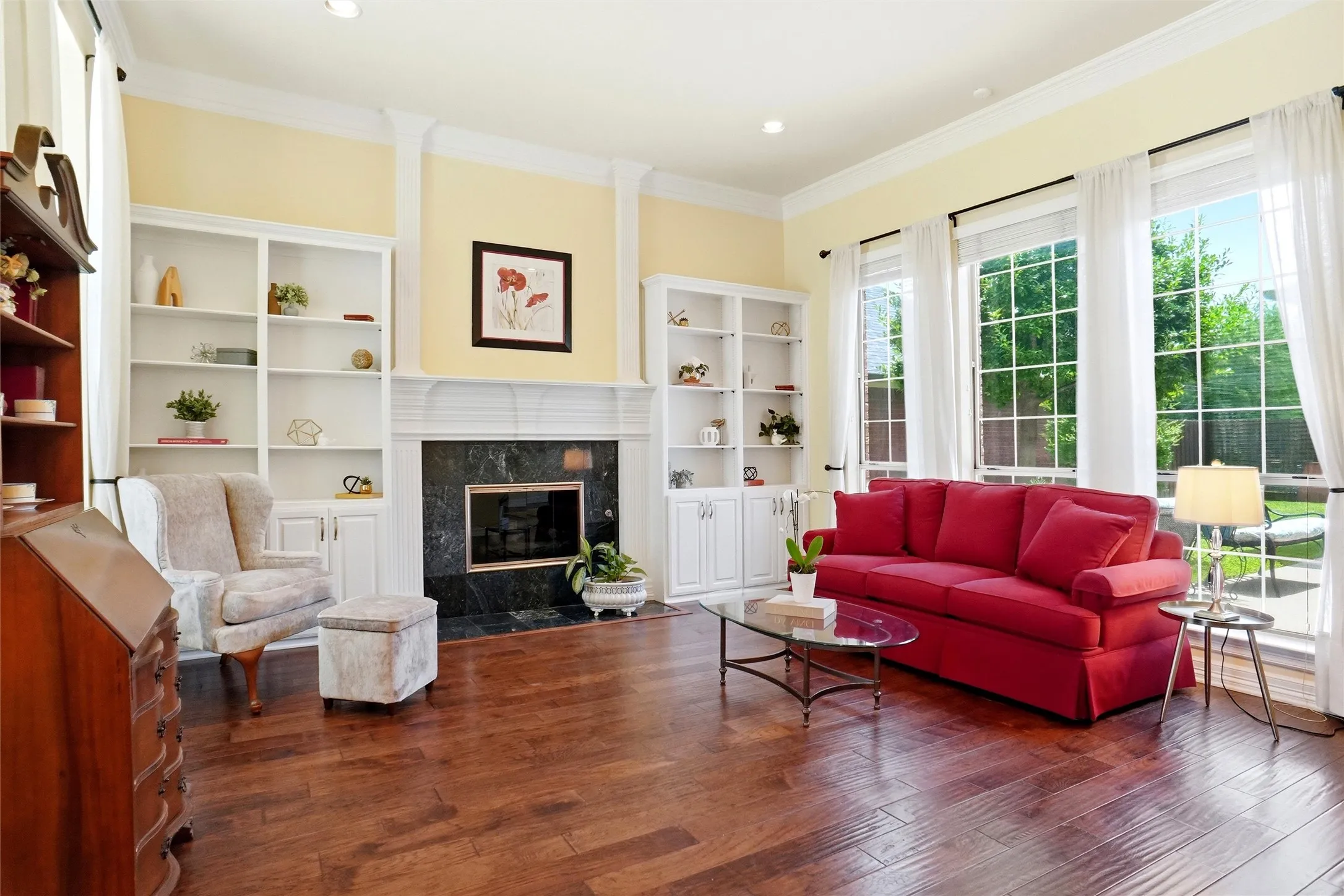 Gas log fireplace, custom cabinets with adjustable shelves, window seat