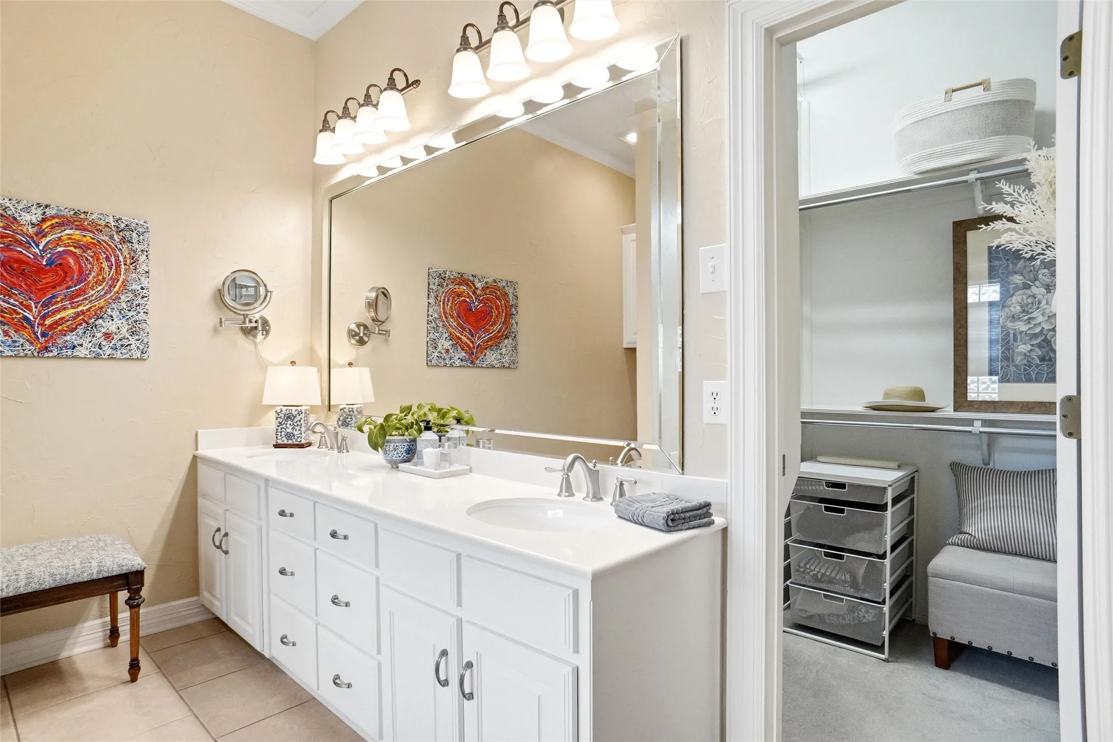 Double sink vanity and large seasonal hang closet.