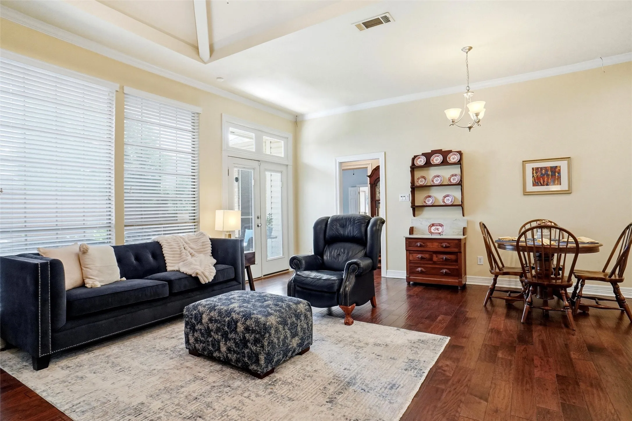 Raised and vaulted ceiling with custom trim and molding. Patio and sideyard access.