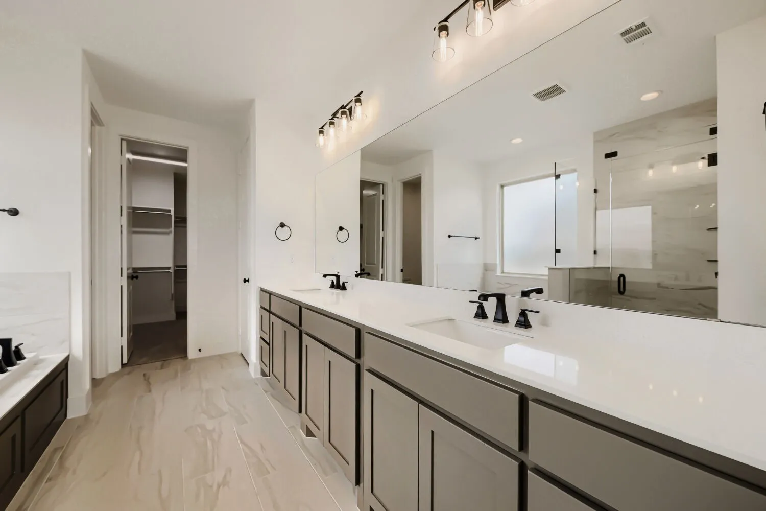 Dual vanity with undermount sinks and matte black fixtures