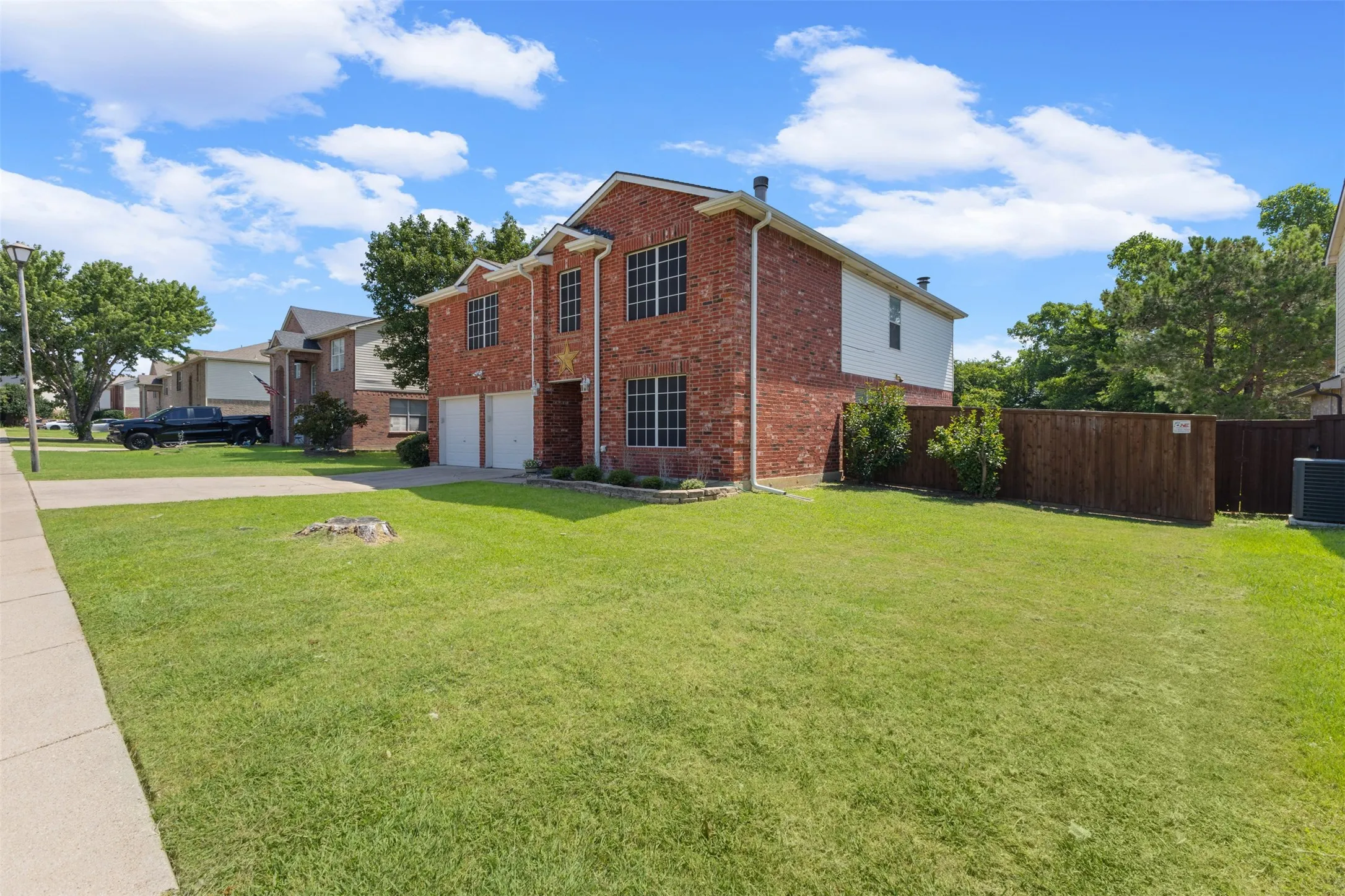 Two-story brick exterior with white trim