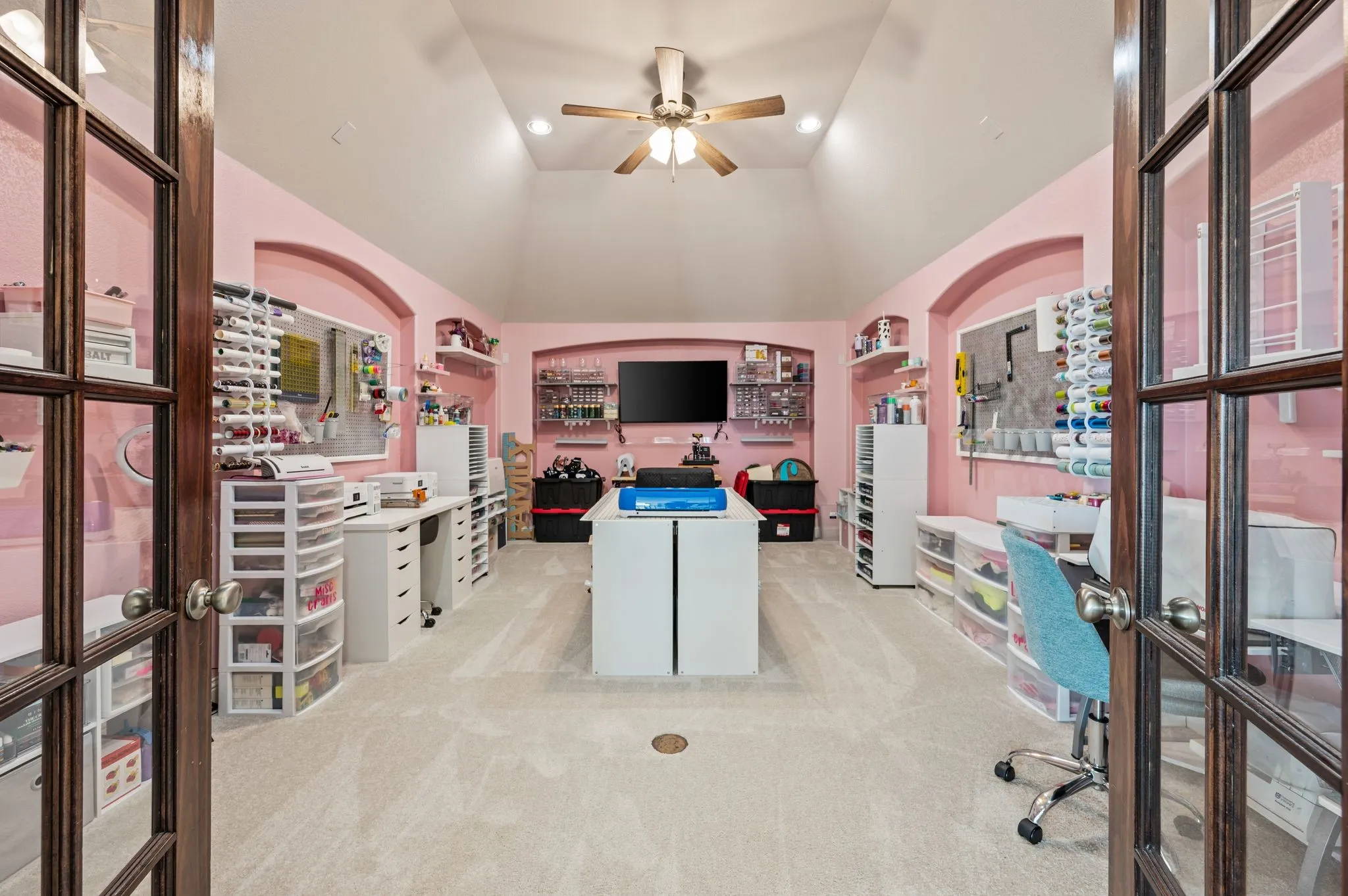Incredible upstairs media/bonus room with French doors, pre-wired for a 7.1 surround sound, but flexible for anything your heart desires!  In floor plugs make it easy to arrange your side table lamps!