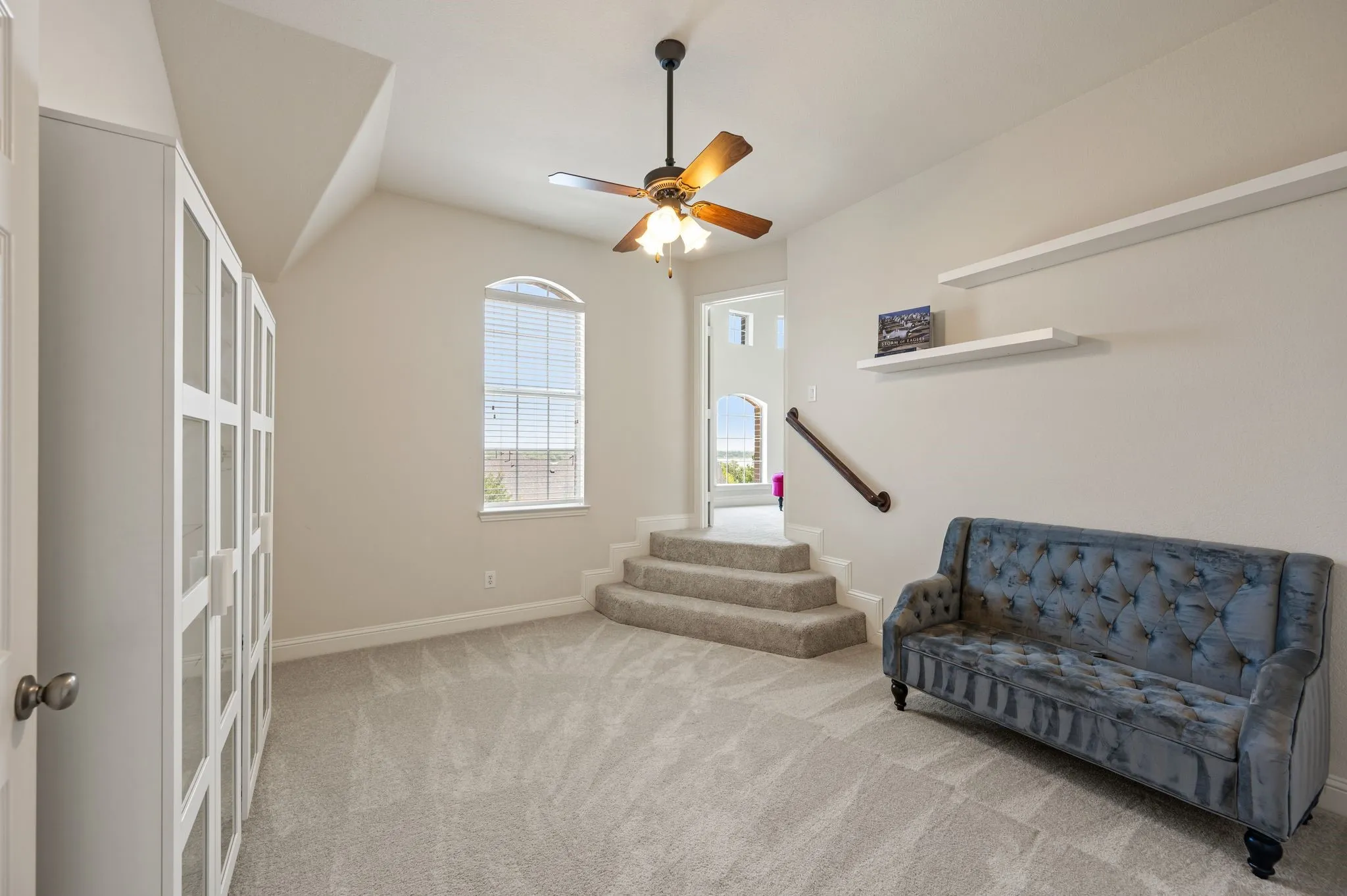 This versatile upstairs bedroom is the bedroom with the coolest feature!  Its own private Juliet balcony!