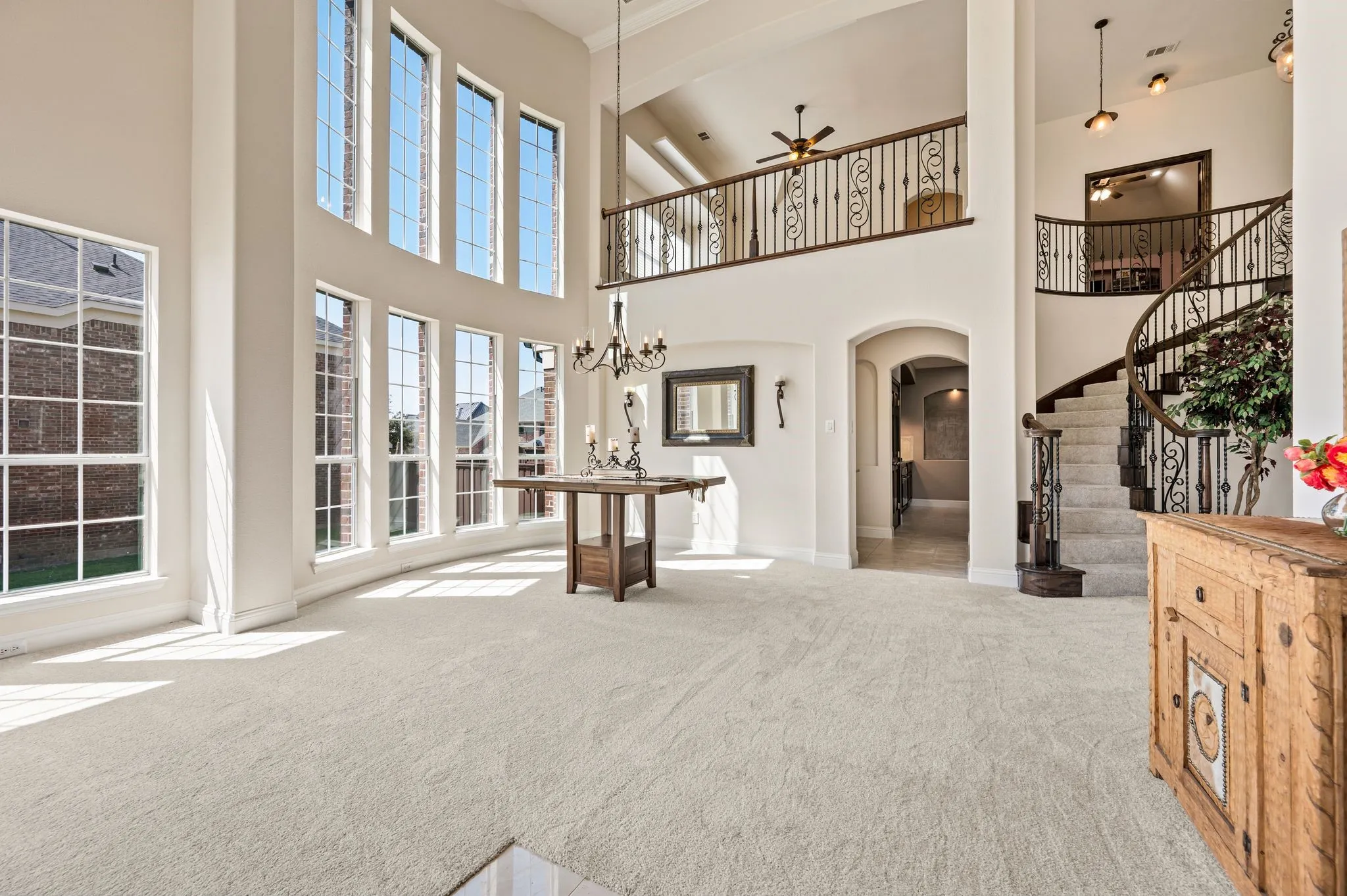 Step inside to an impressive grand foyer featuring soaring 20' ceilings, dramatic windows & abundant natural light! Also notice the brand new carpet!