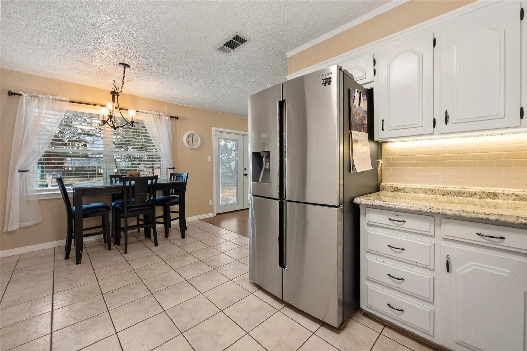 Kitchen has abundant cabinet and counter space.