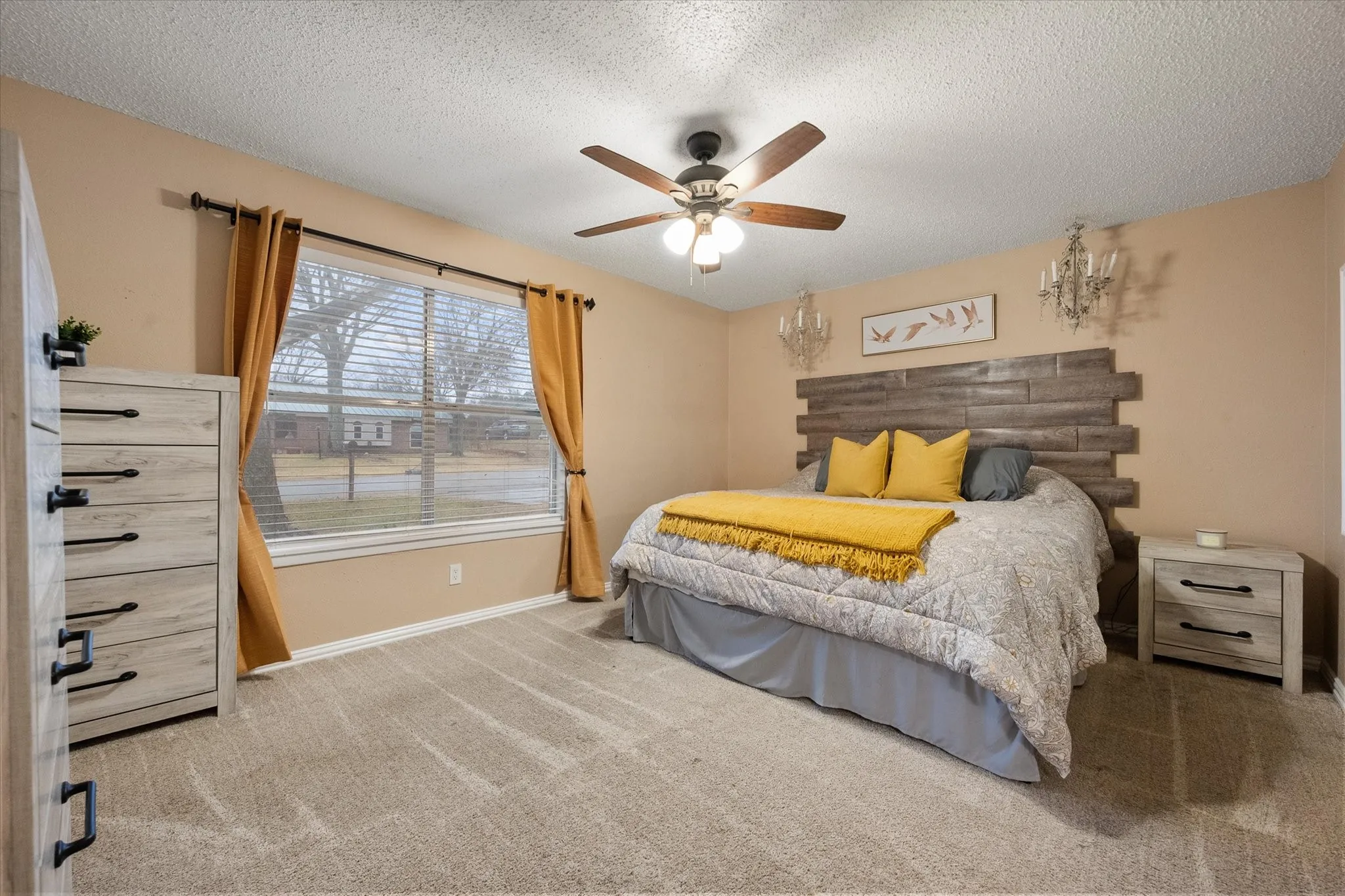 Primary bedroom has plush carpet and en suite bath.