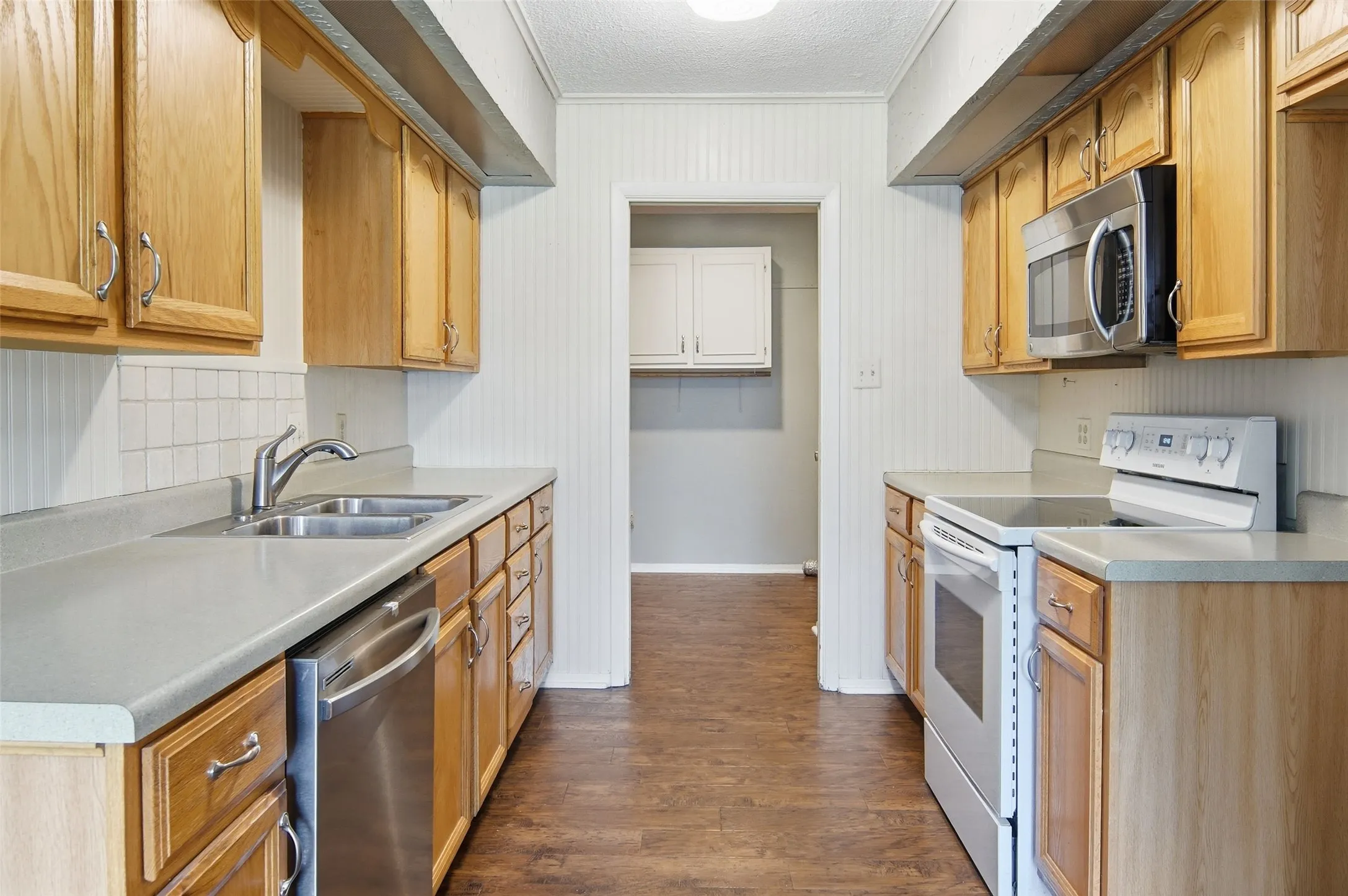 Kitchen leads into Utility Room