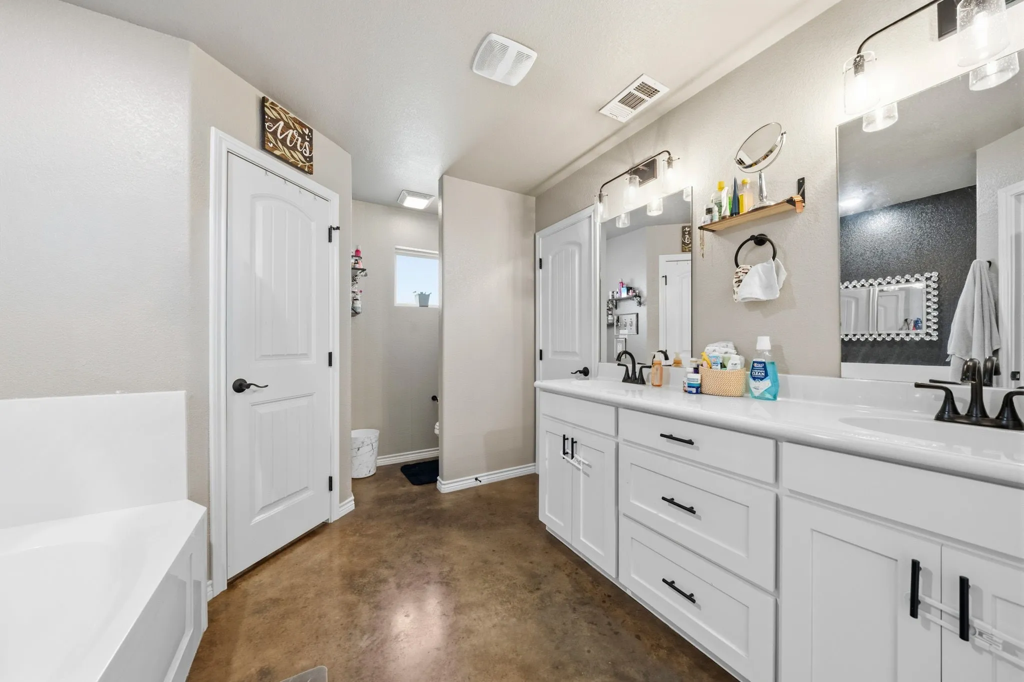 Primary ensuite bathroom with dual sinks