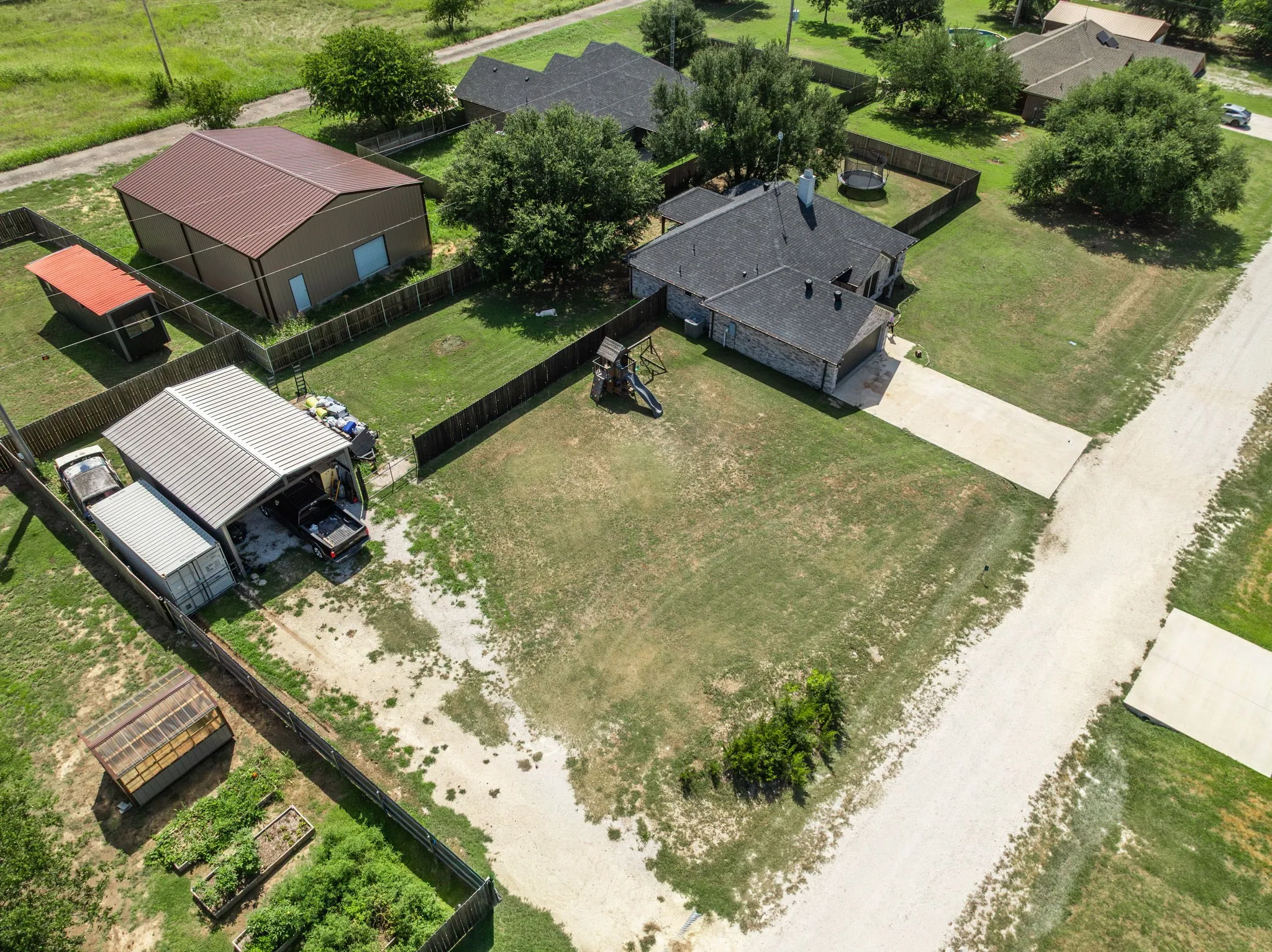 Full privacy fenced backyard with RV or boat parking
