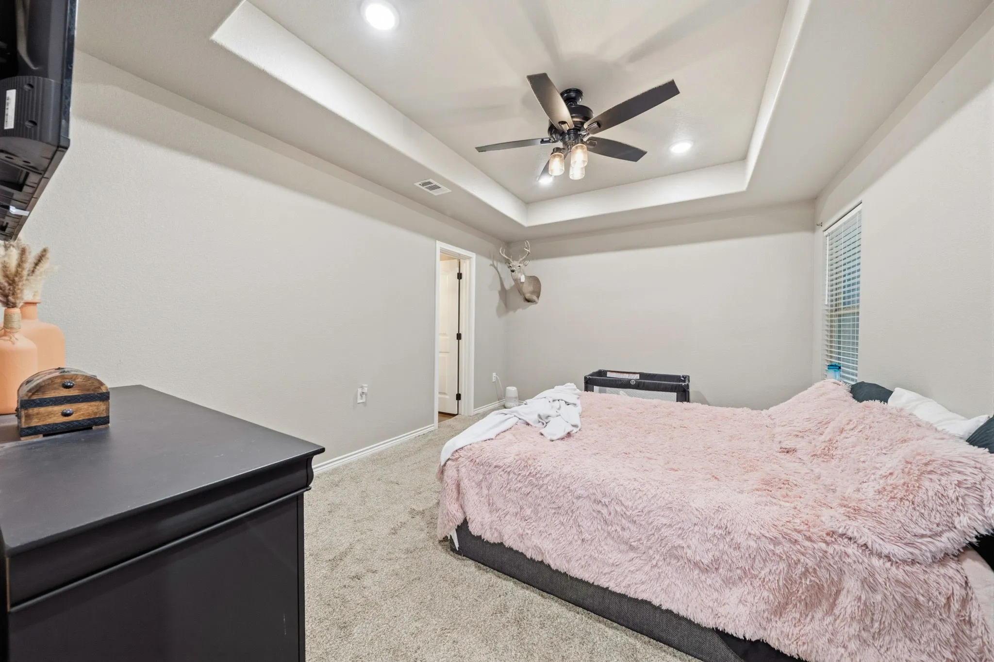 Primary bedroom with attached ensuite bath.
