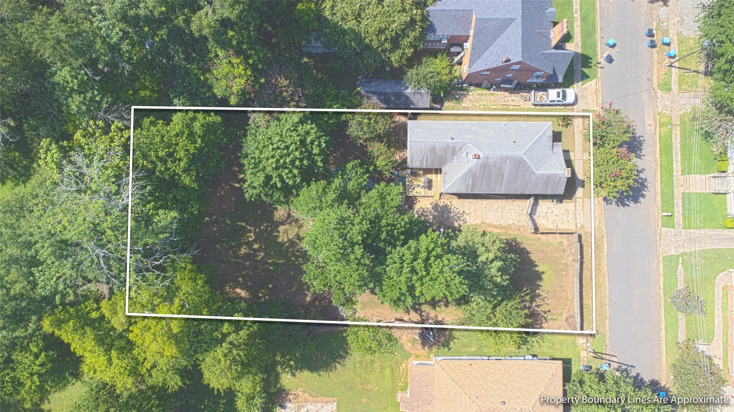 Aerial perspective showcasing a single-story residence with a gray shingled roof