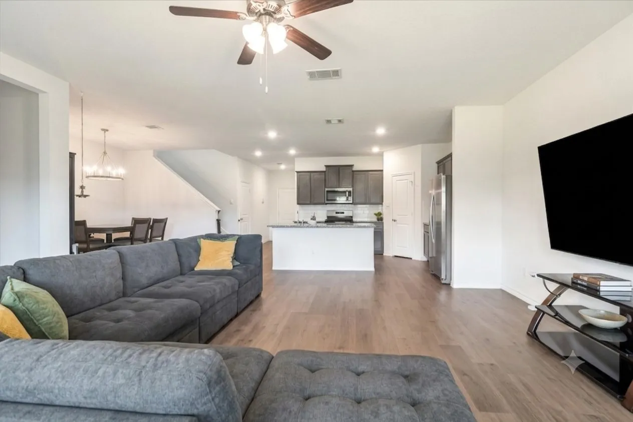 Open-concept living space featuring wood-finish flooring, recessed lighting, and a ceiling​​‌​​​​‌​​‌‌​‌‌​​​‌‌​‌​‌​‌​​​‌​​ fan