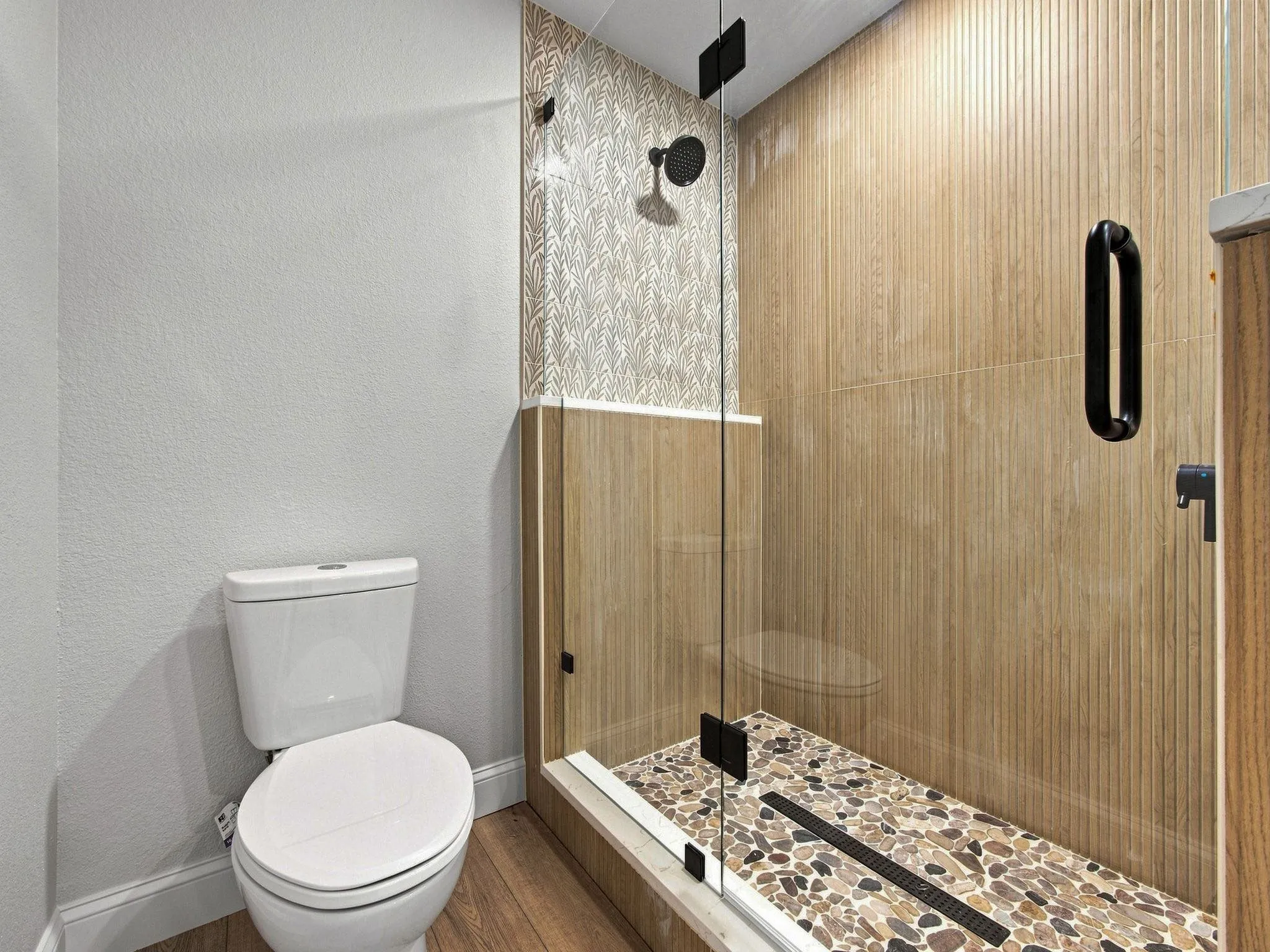 Primary bathroom glass enclosed shower