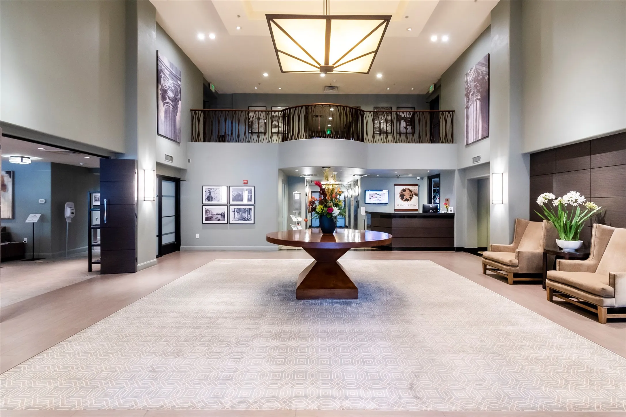 Community lobby featuring a high ceiling and recessed lighting