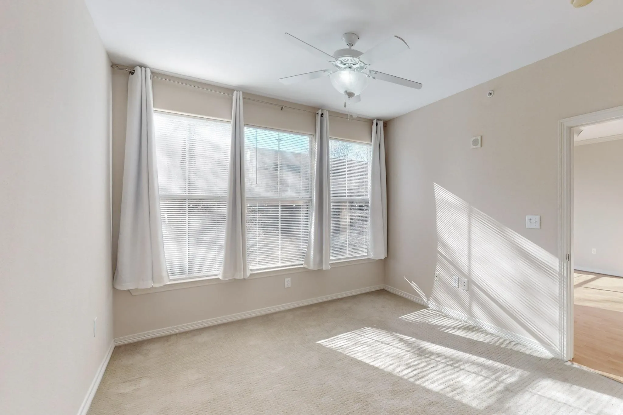 Spare room with carpet flooring and a ceiling fan