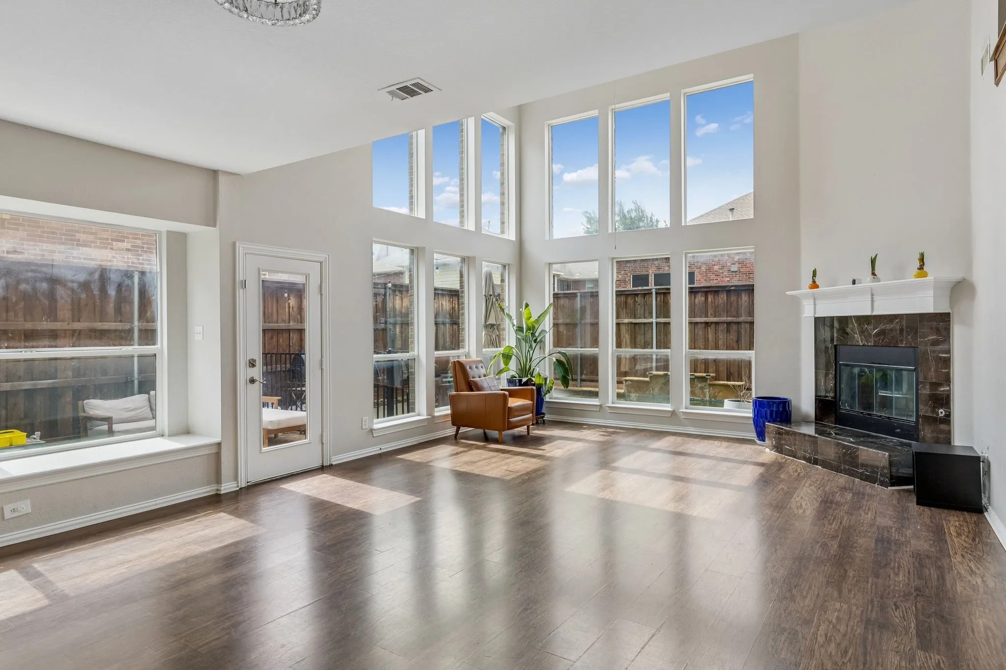 Family room with views of sideyard and pool.
