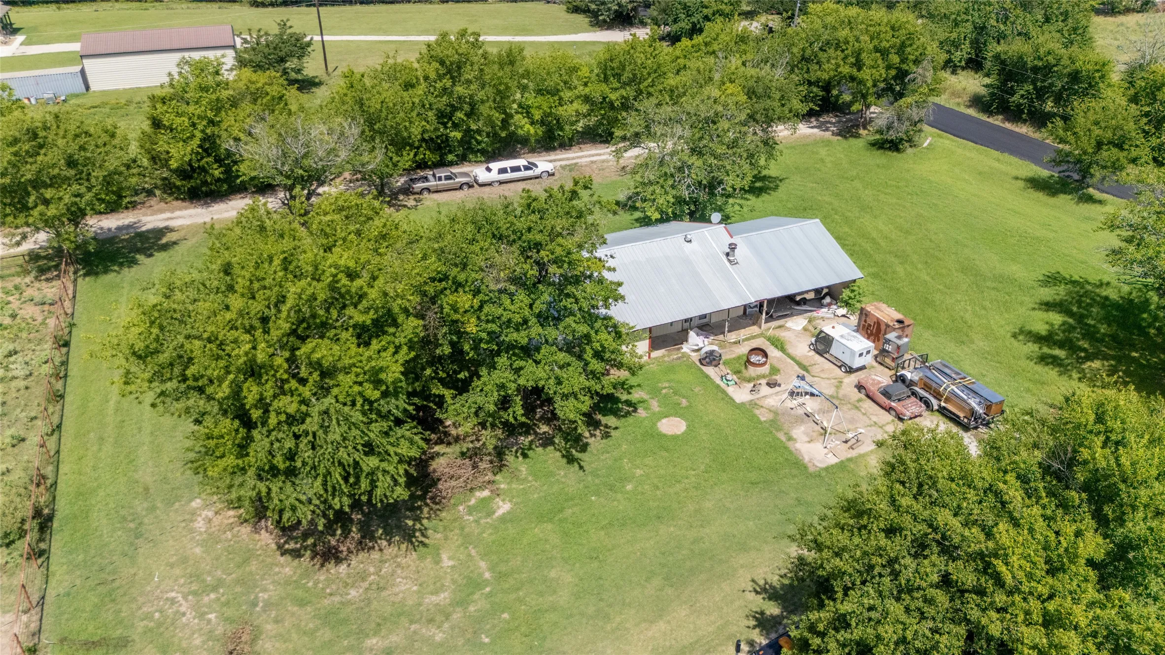 Single-story residence with a metal roof and covered porch