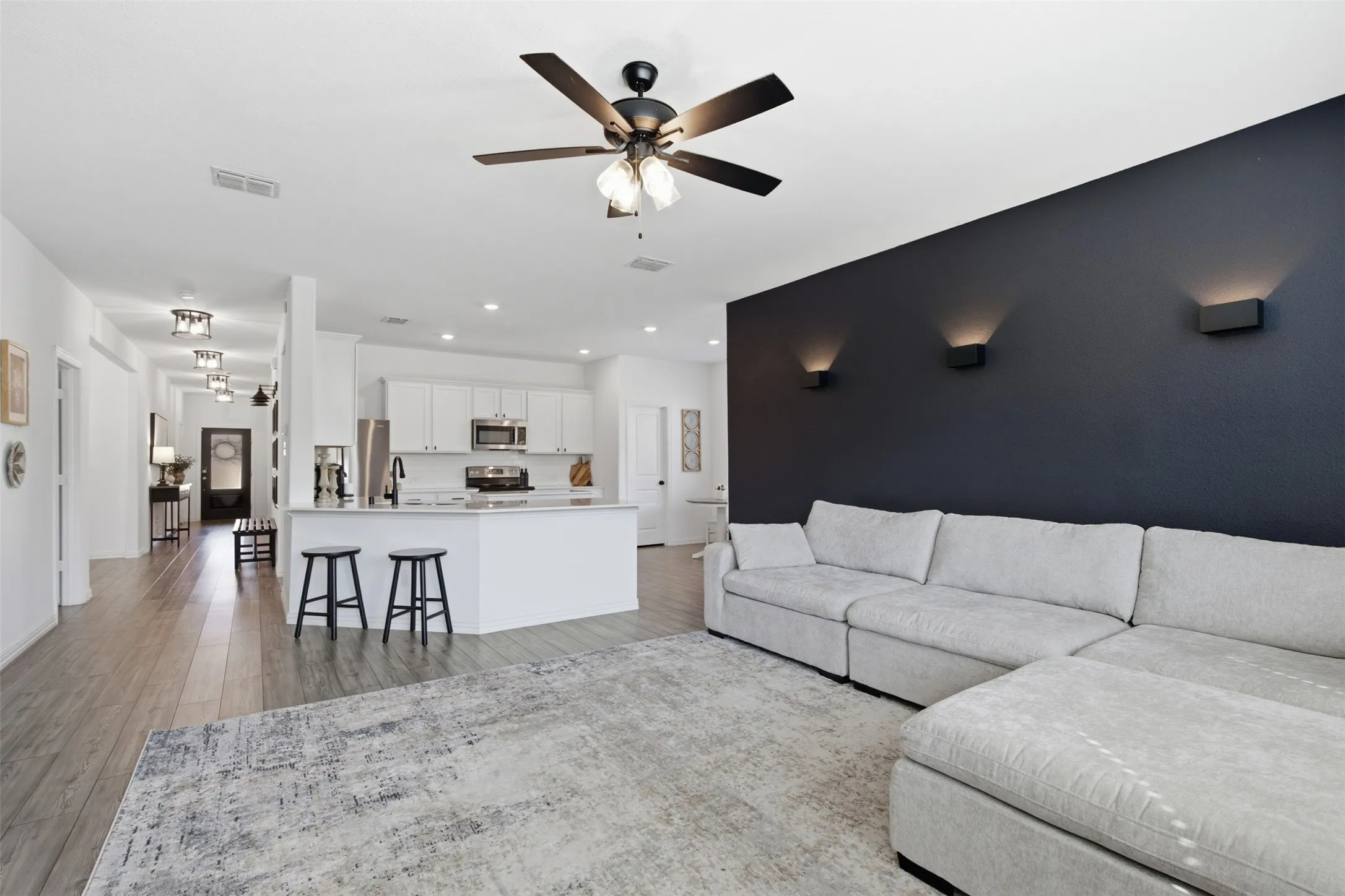 Open concept living, kitchen with casual counter height seating