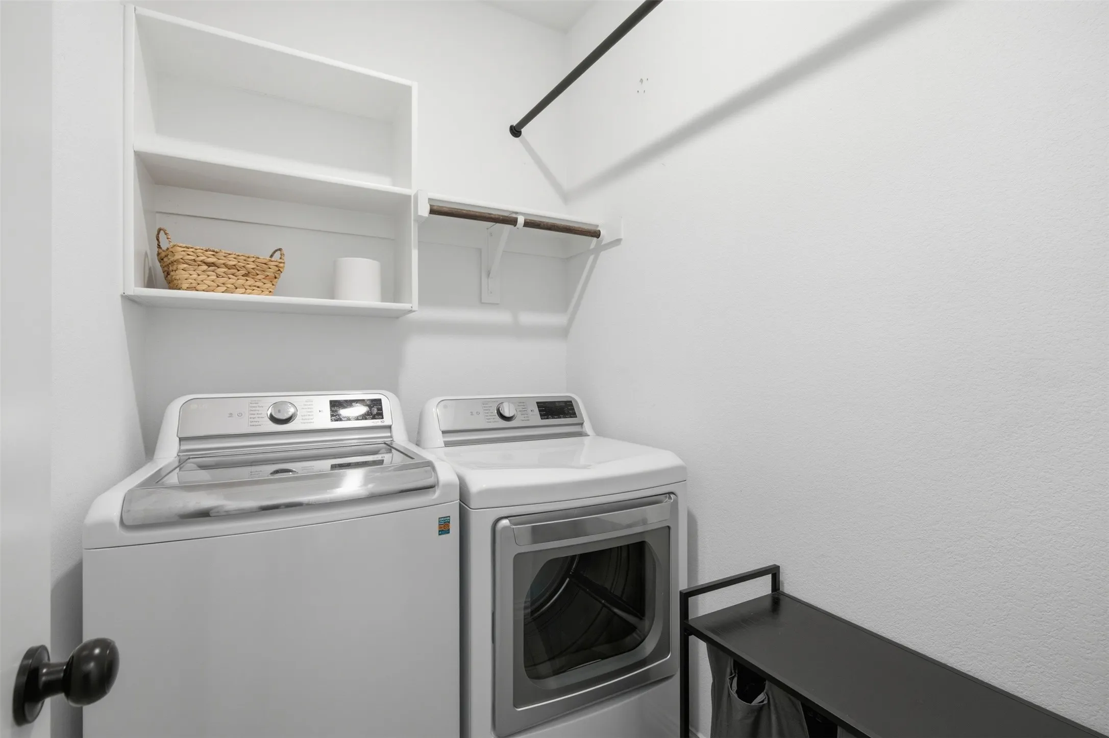 Spacious laundry with ample storage and hanging space