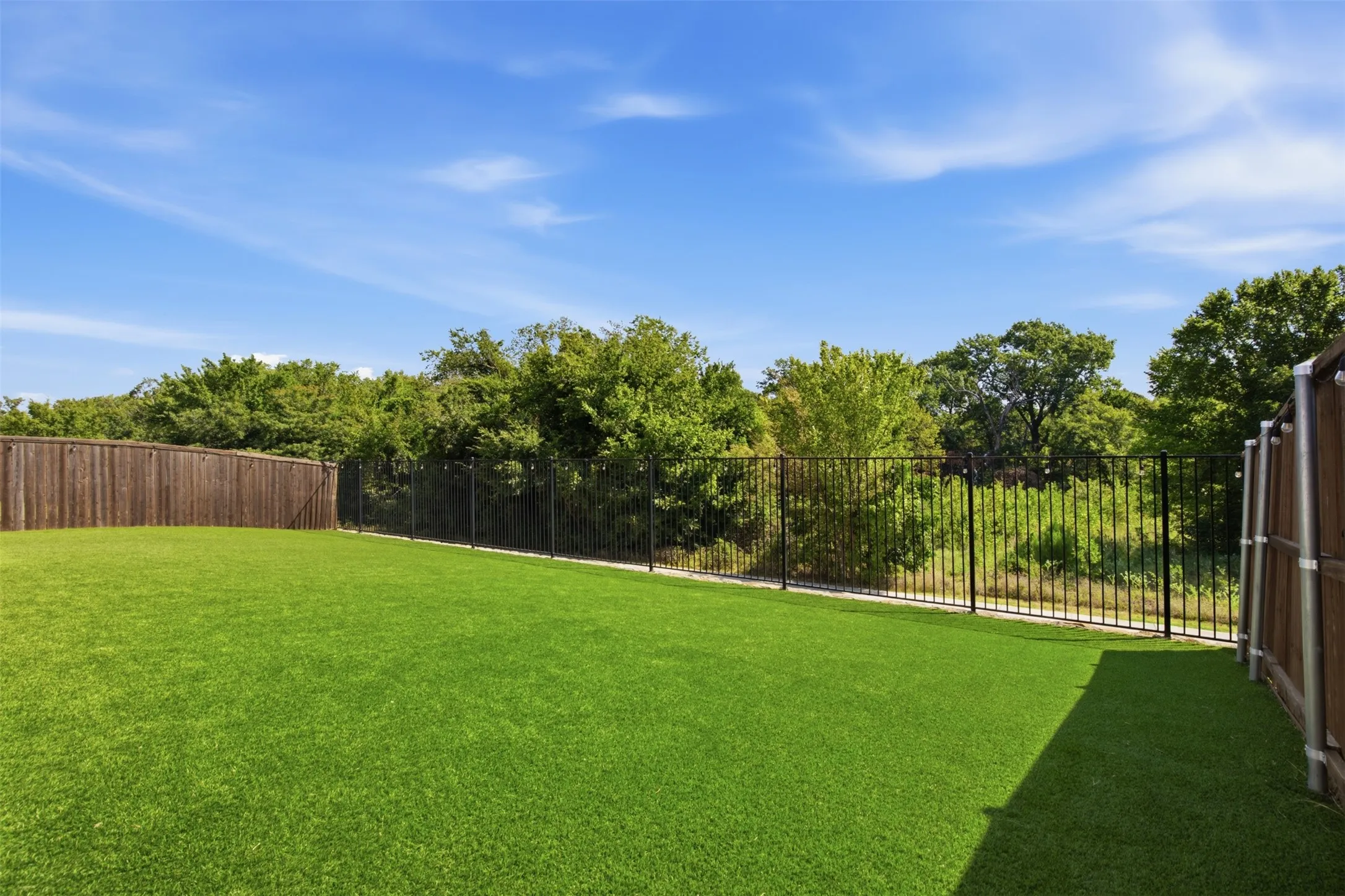 Turfed backyard, over looks the community walking trail and 24.31 preserve land