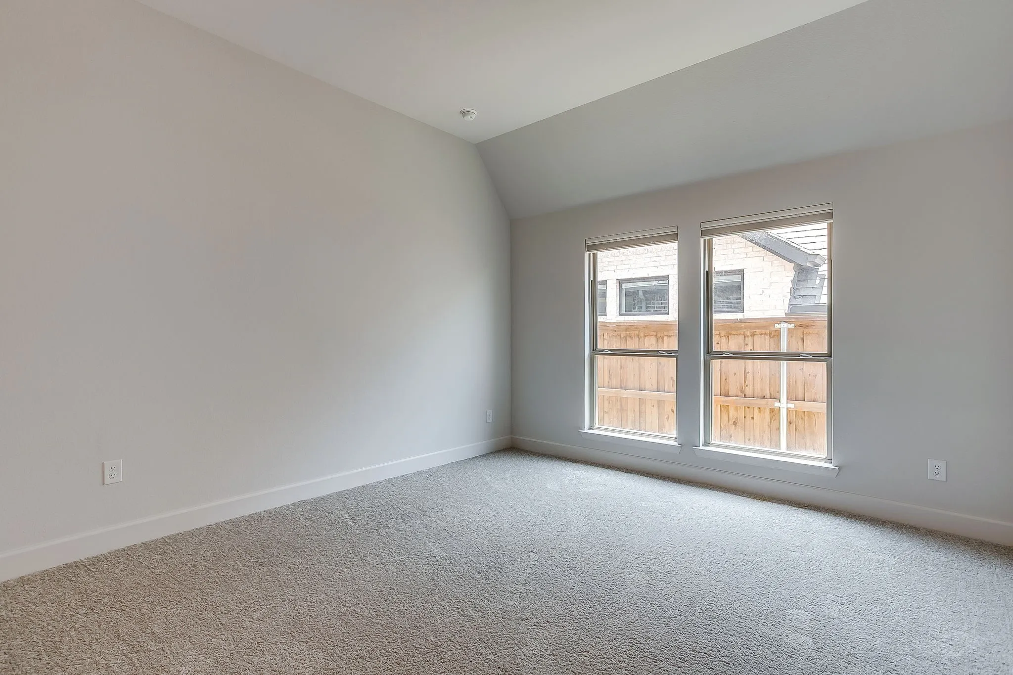 Neutral-toned carpeting paired with light gray walls and white trim