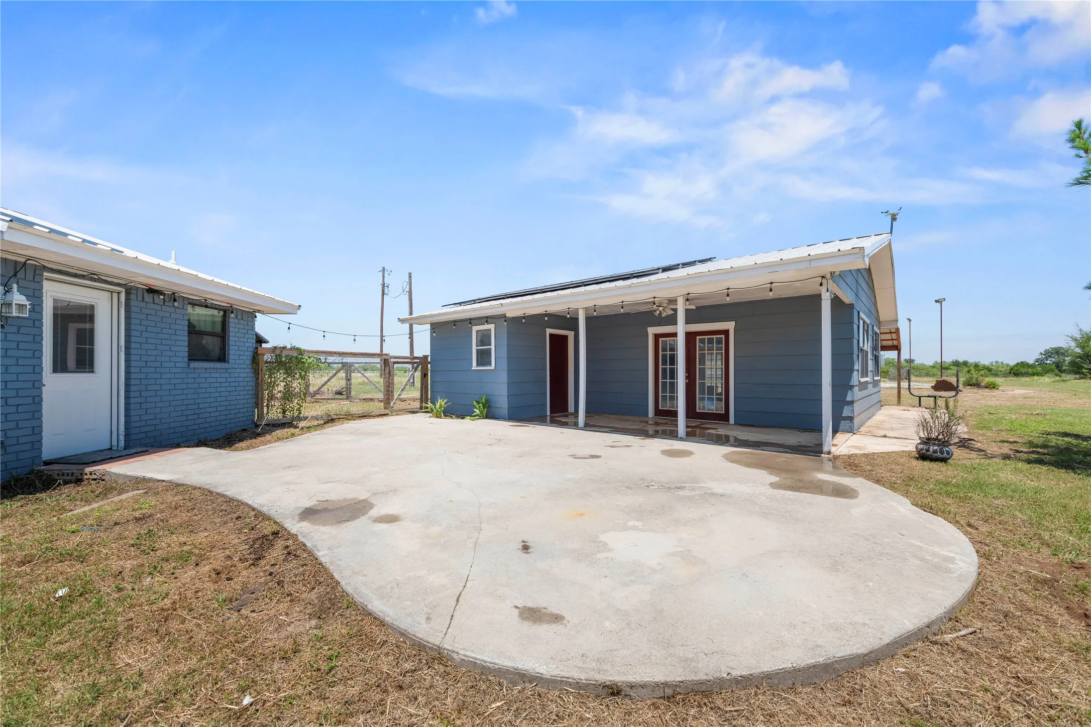 Spacious patio connects the main home to the plumbed flex space, perfect for entertaining or relaxing outdoors.