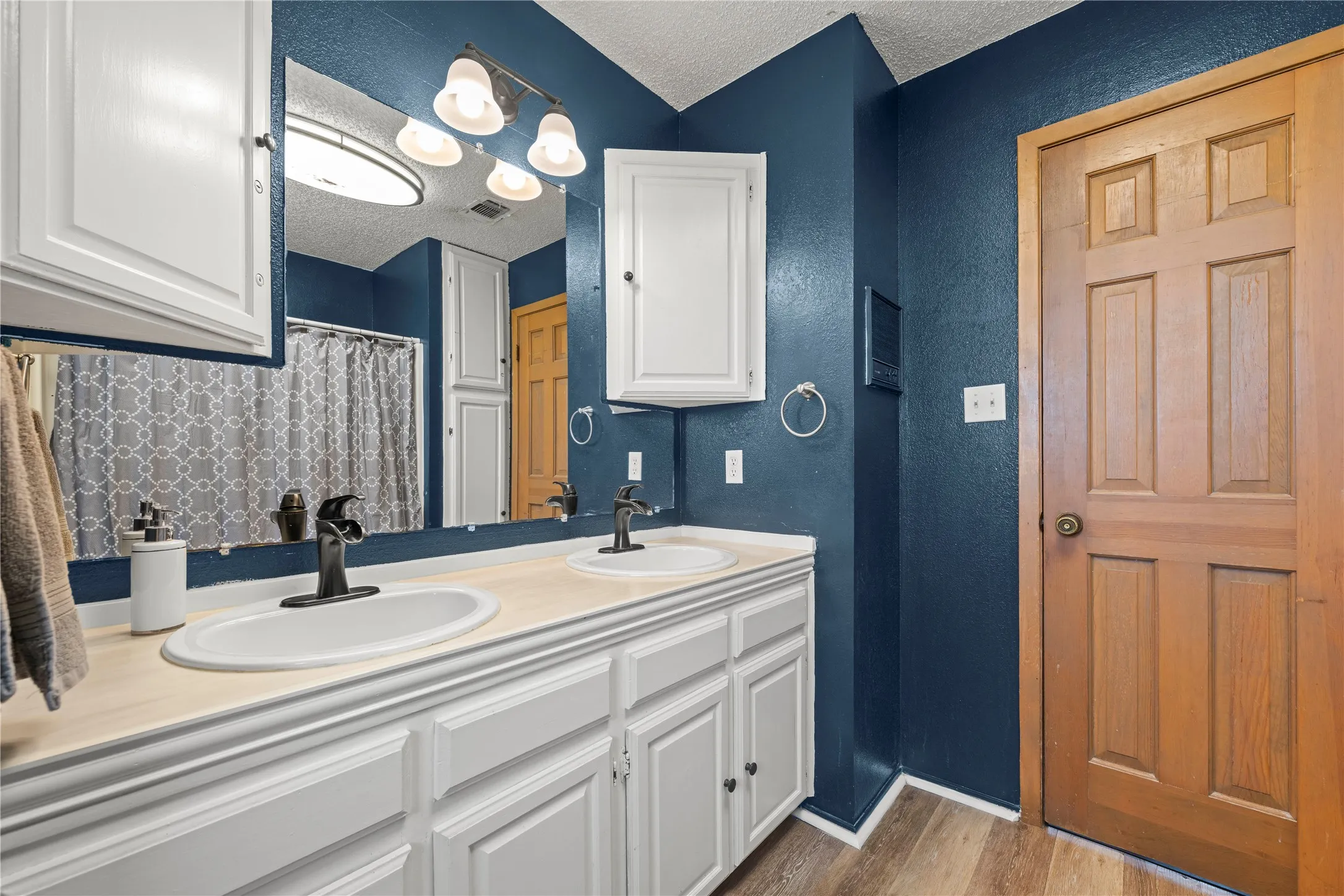 Guest bathroom offering a double vanity for everyday convenience