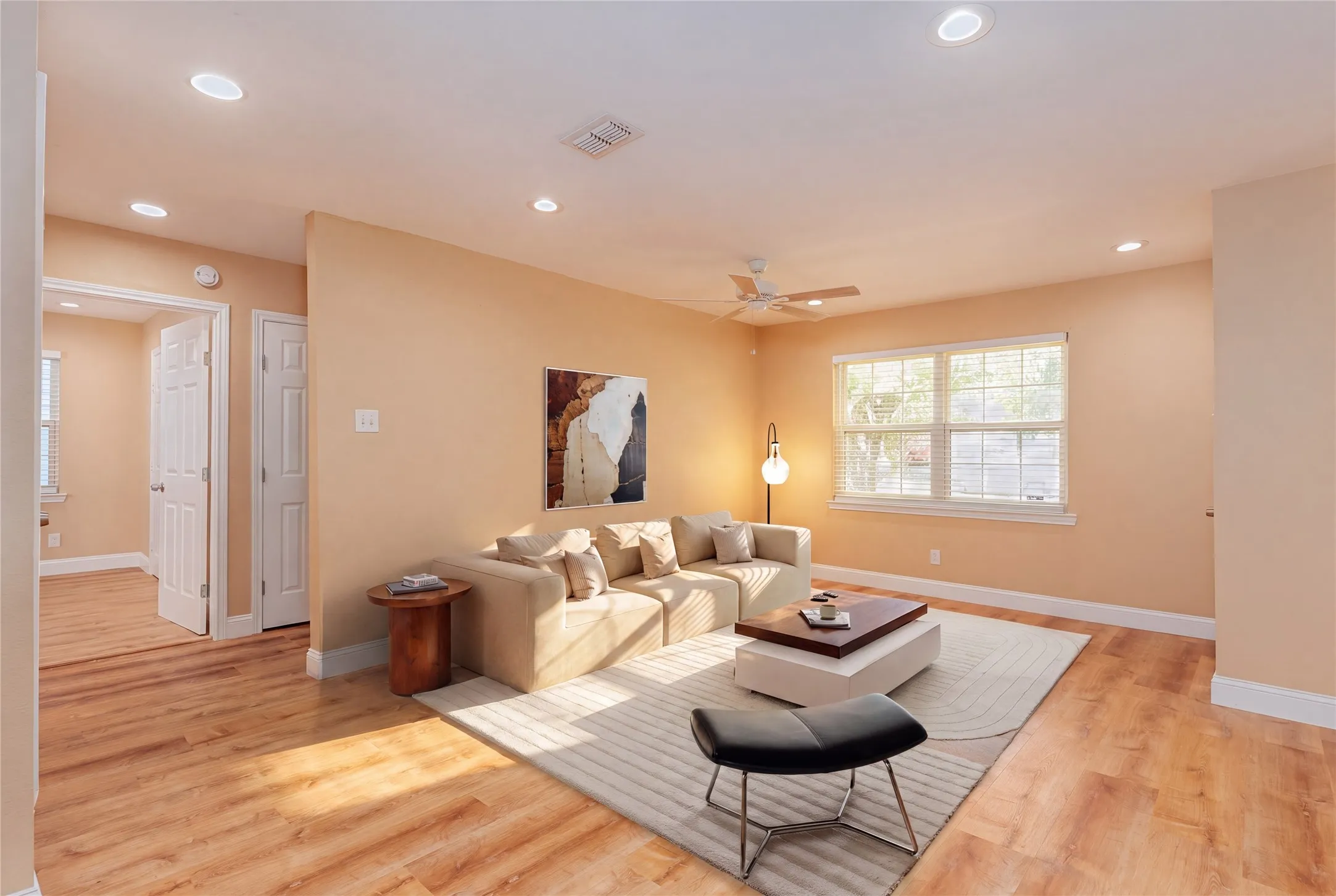 Recessed lighting, LVP flooring, white trim, ceiling fan, and multiple windows