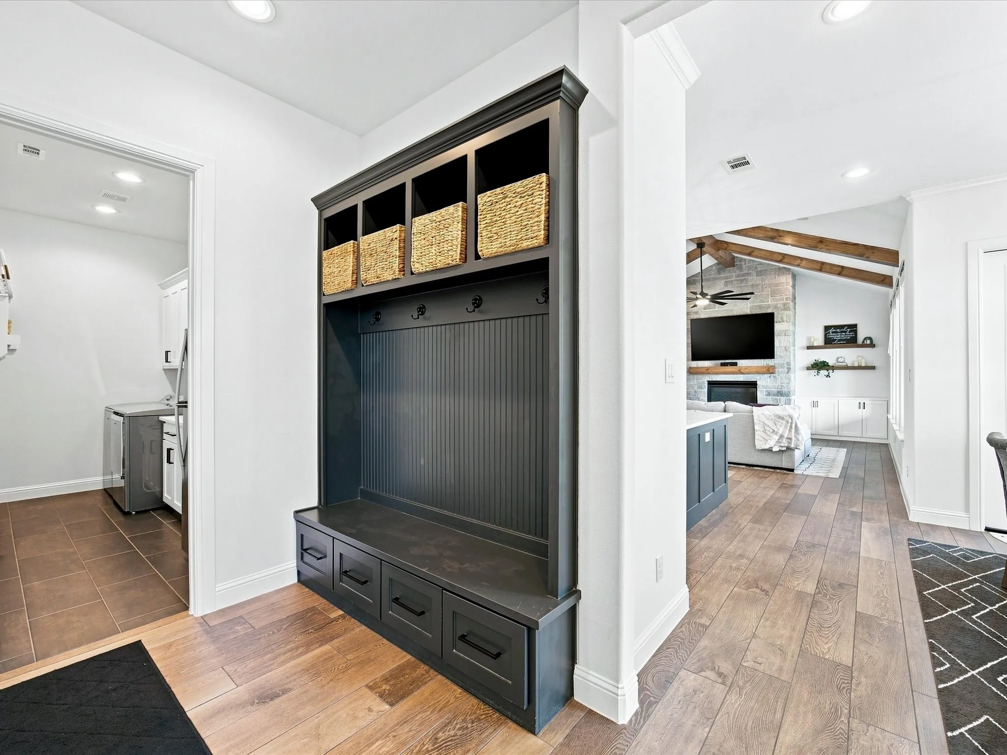 Built-in mudroom storage with beadboard backing