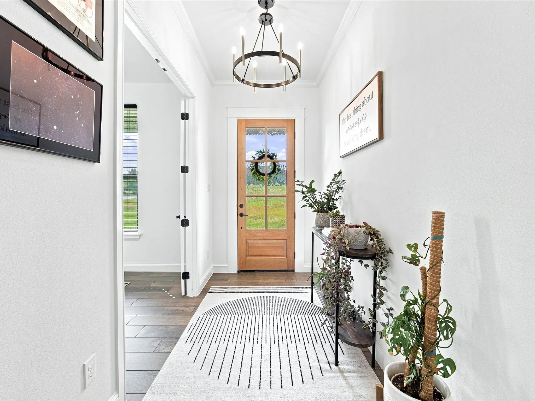 Wood-finish flooring, recessed lighting, and a front entry door with a frosted glass panel
