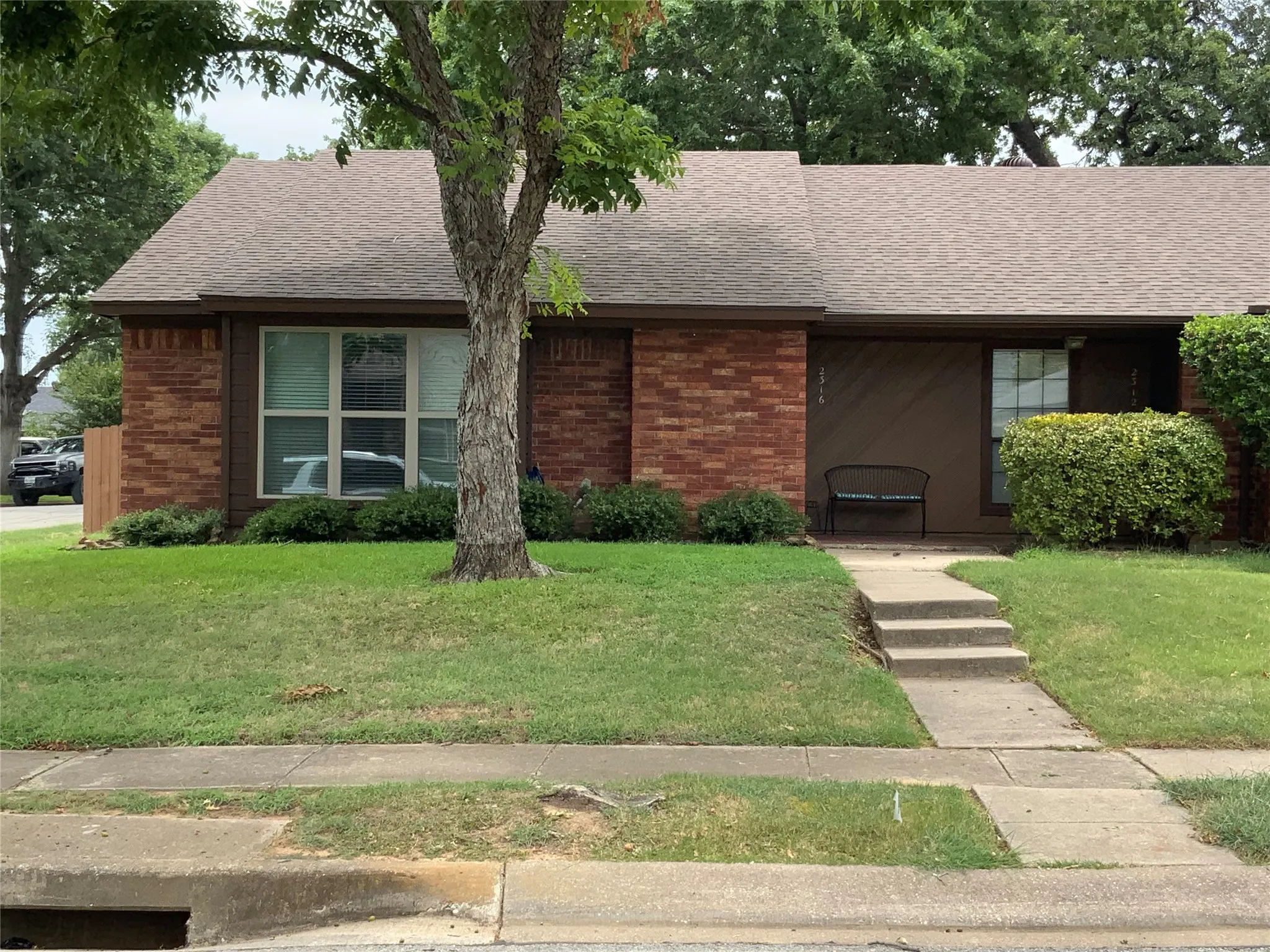 Brick and siding exterior with a shingle roof