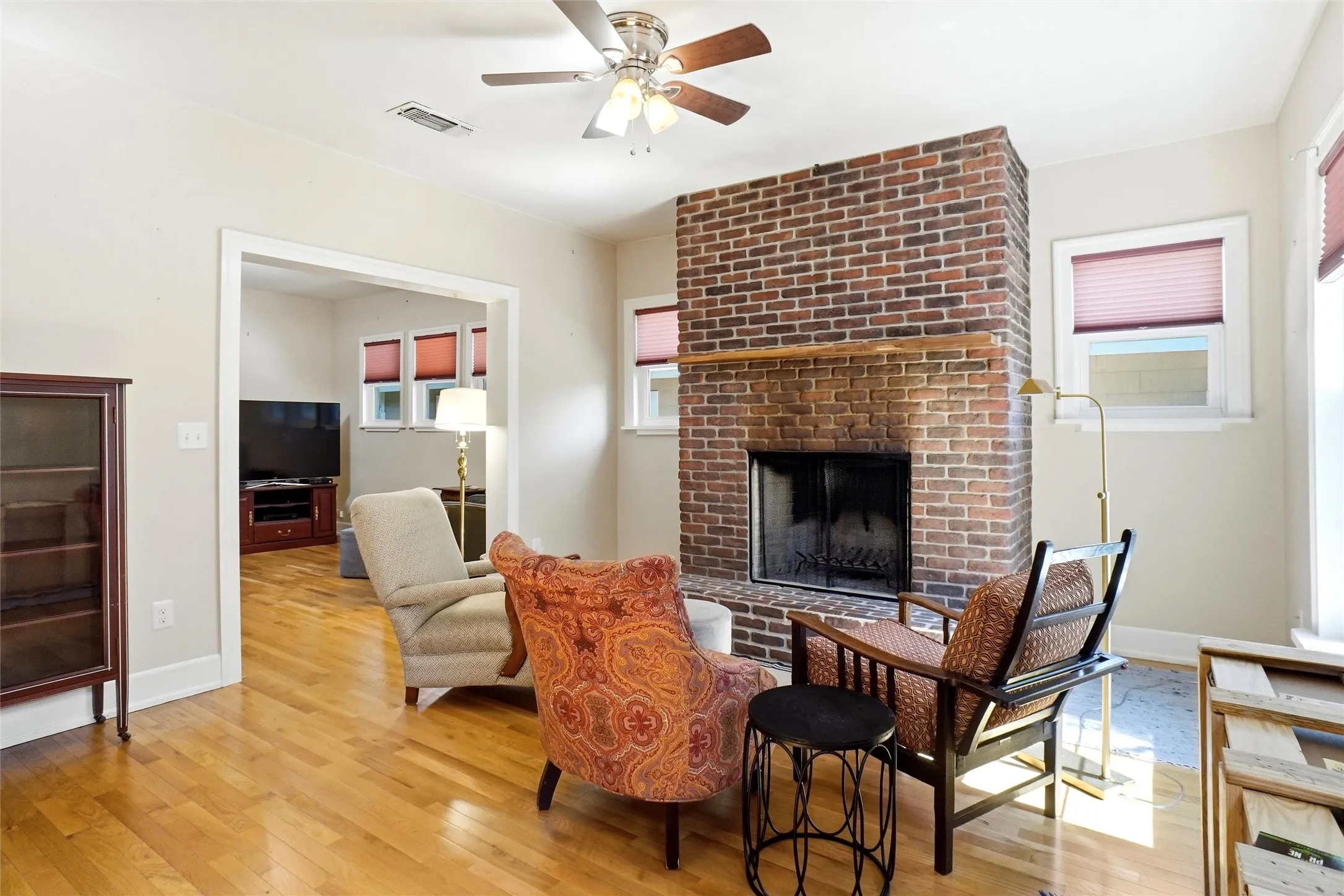 Brick fireplace with a wood mantel