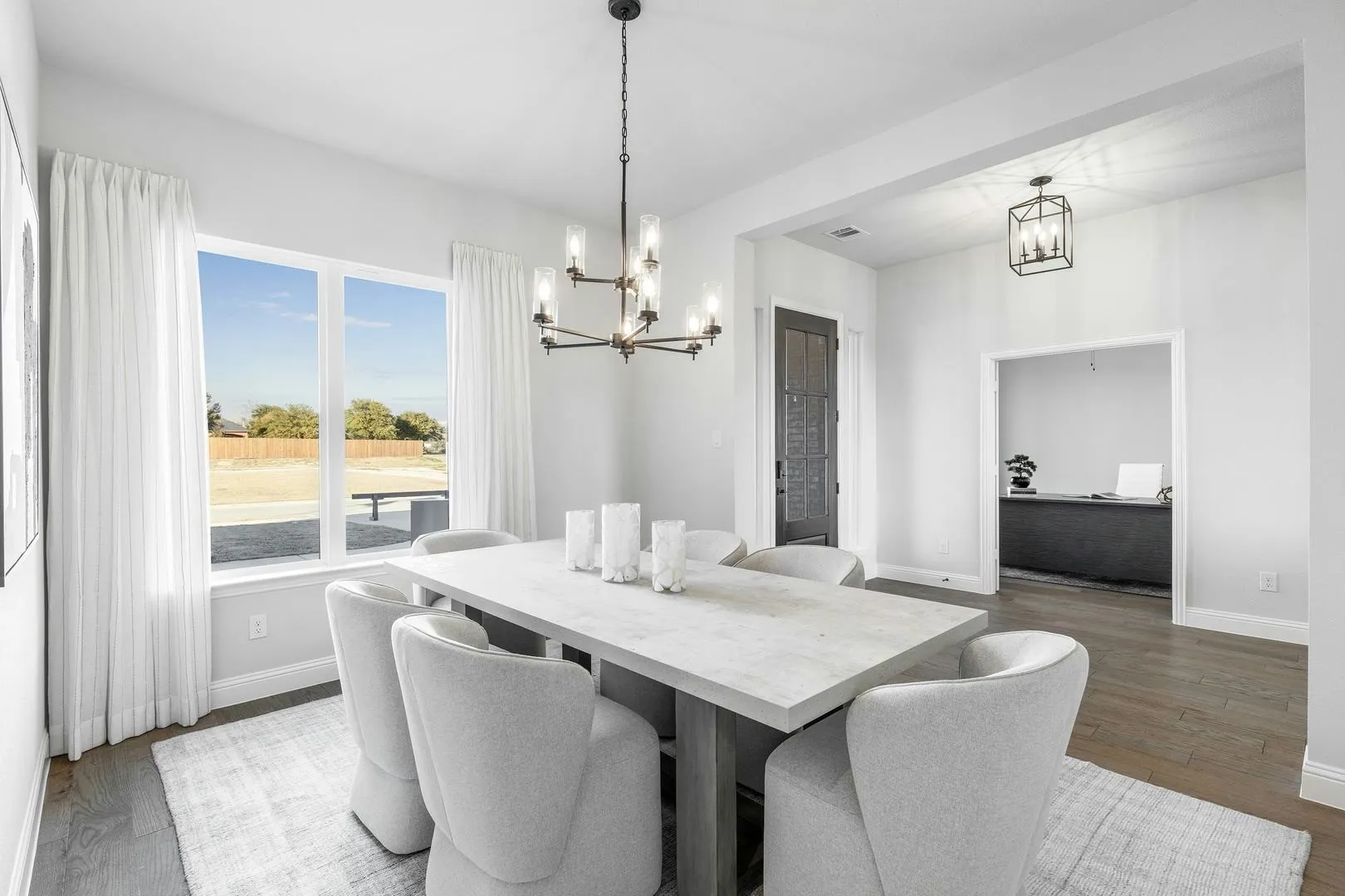 Dining room and entryway of Kentsdale Farms home in DeSoto, TX by Kindred Homes