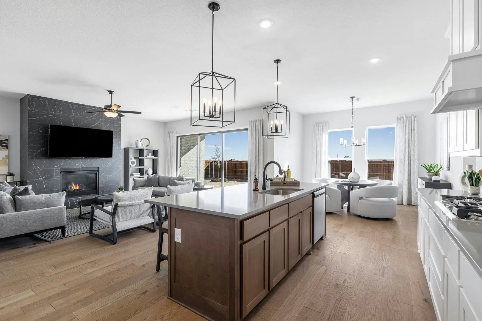Kitchen and living room of Kentsdale Farms home in DeSoto, TX by Kindred Homes