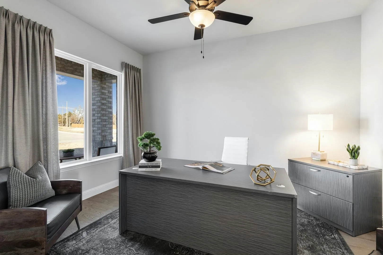 Study in a transitional ranch style home by Kindred Homes