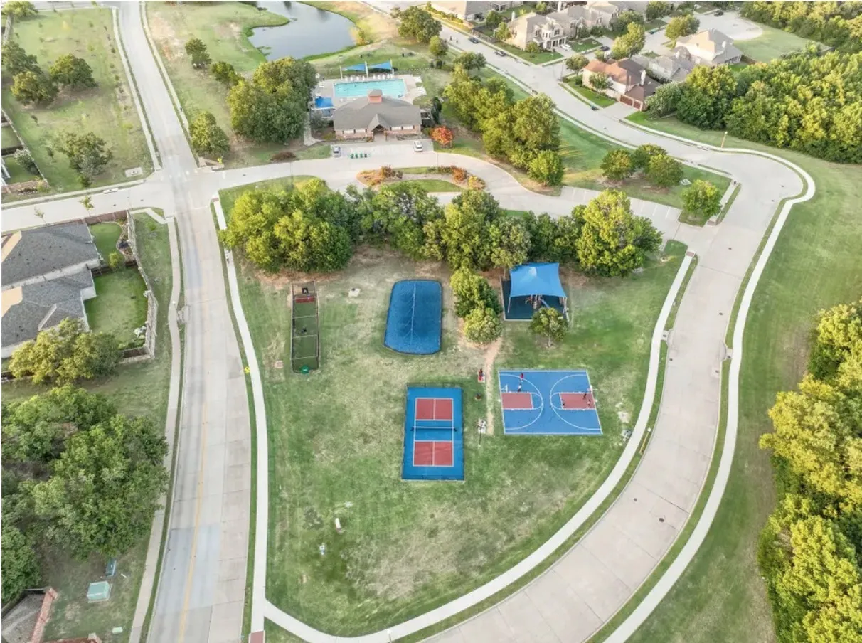 Community recreational area featuring a basketball court, tennis court, and covered seating