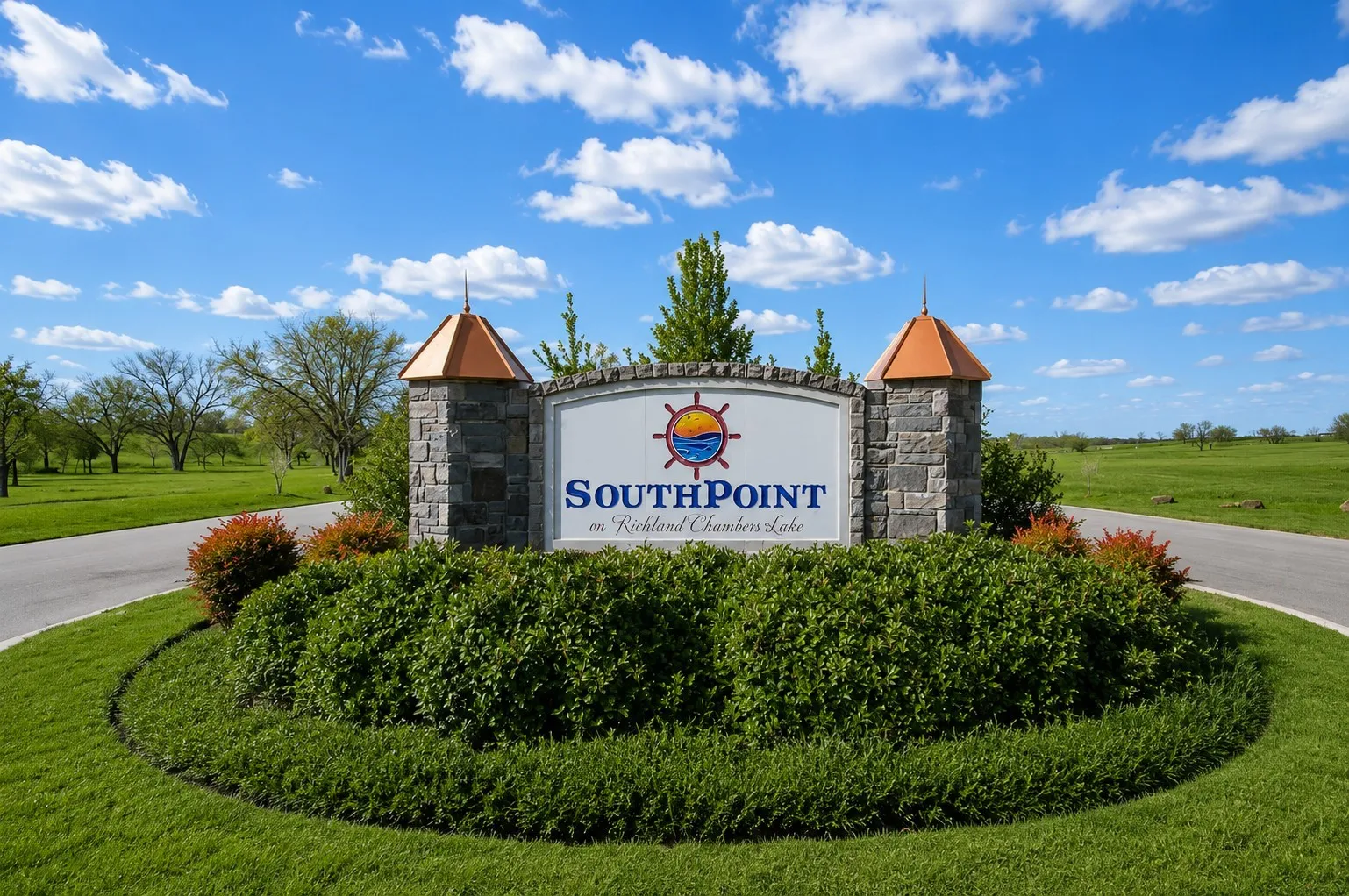 Beautifully landscaped Southpoint monument sign at the gated community entrance.