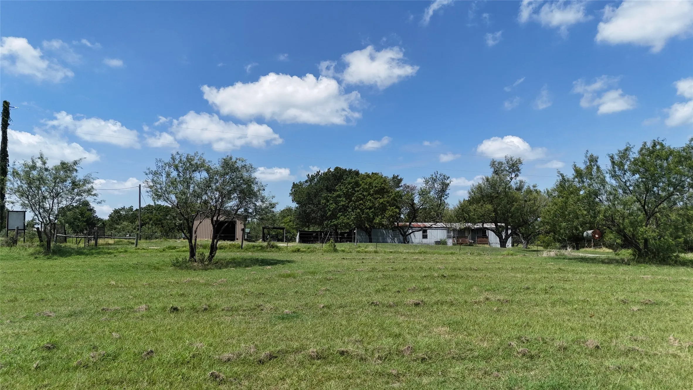 Cleared lot with fence at back of property.