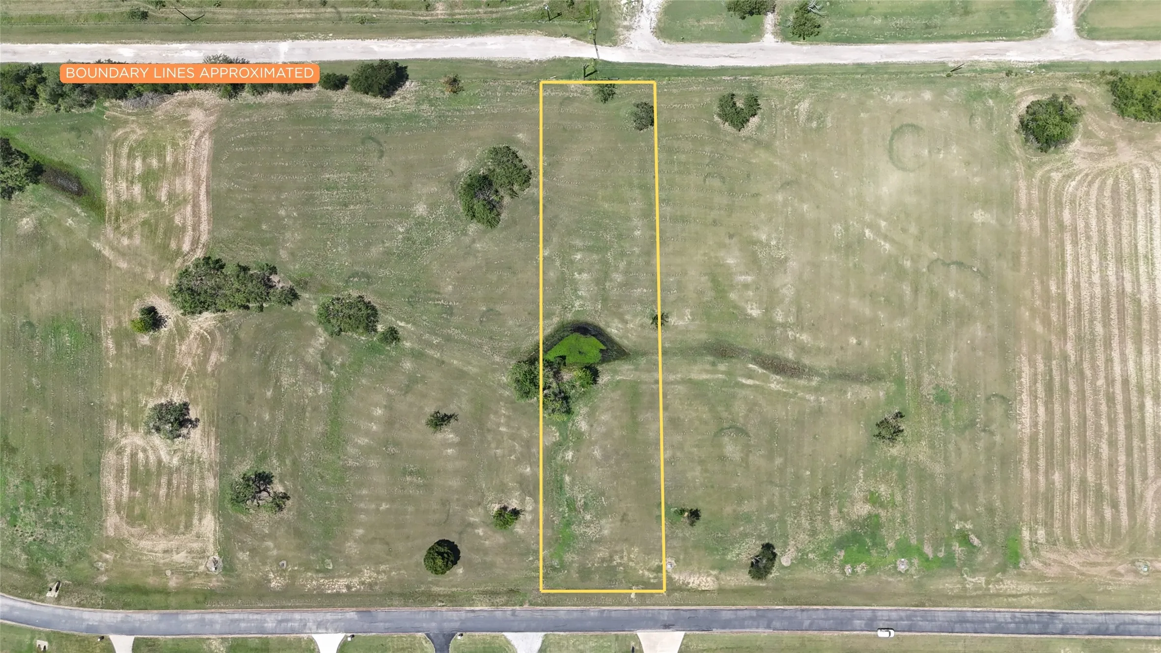 Survey-style aerial showing approximate lot boundaries and property dimensions.