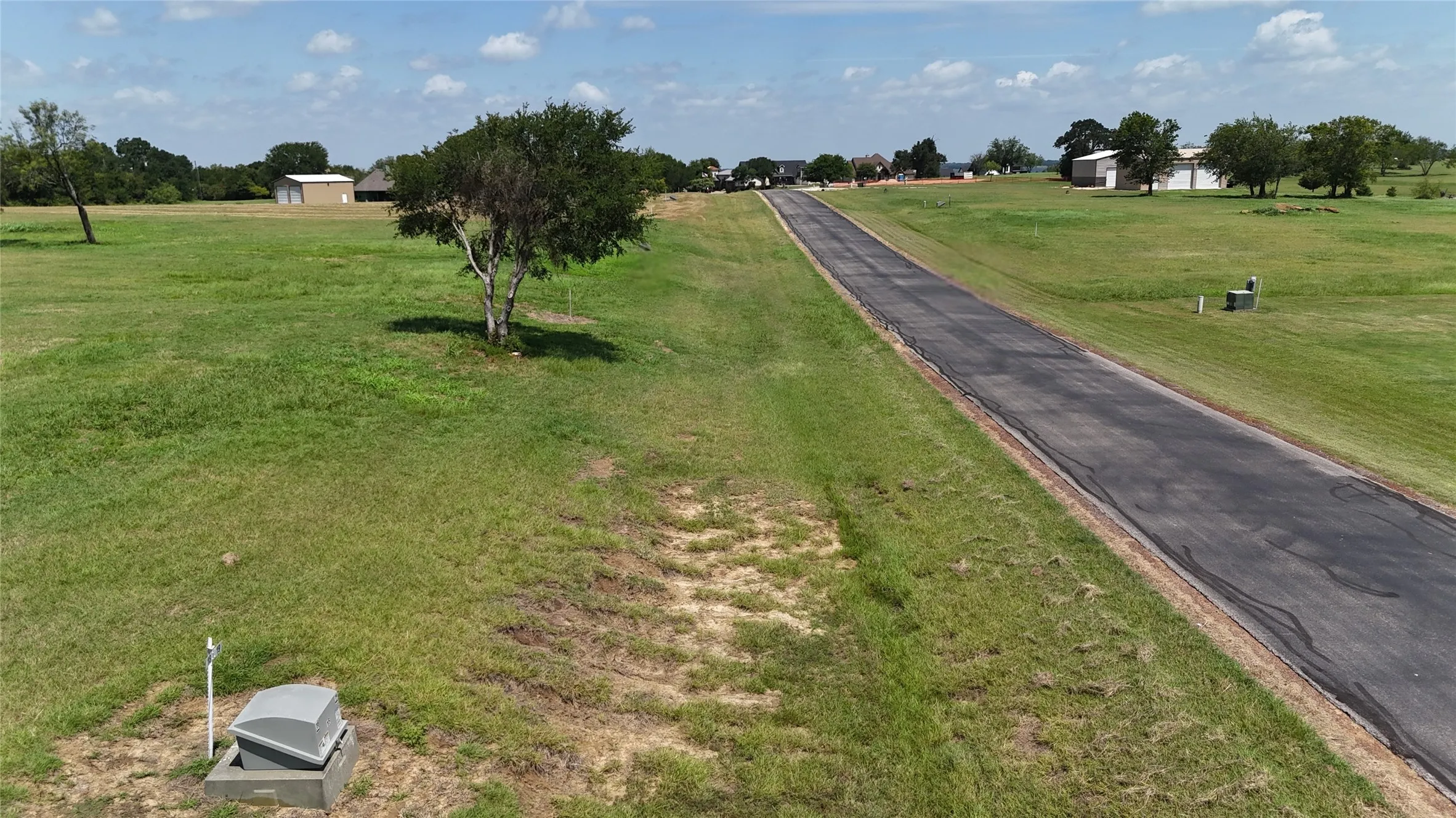 Road frontage provides convenient access to this cleared residential lot.