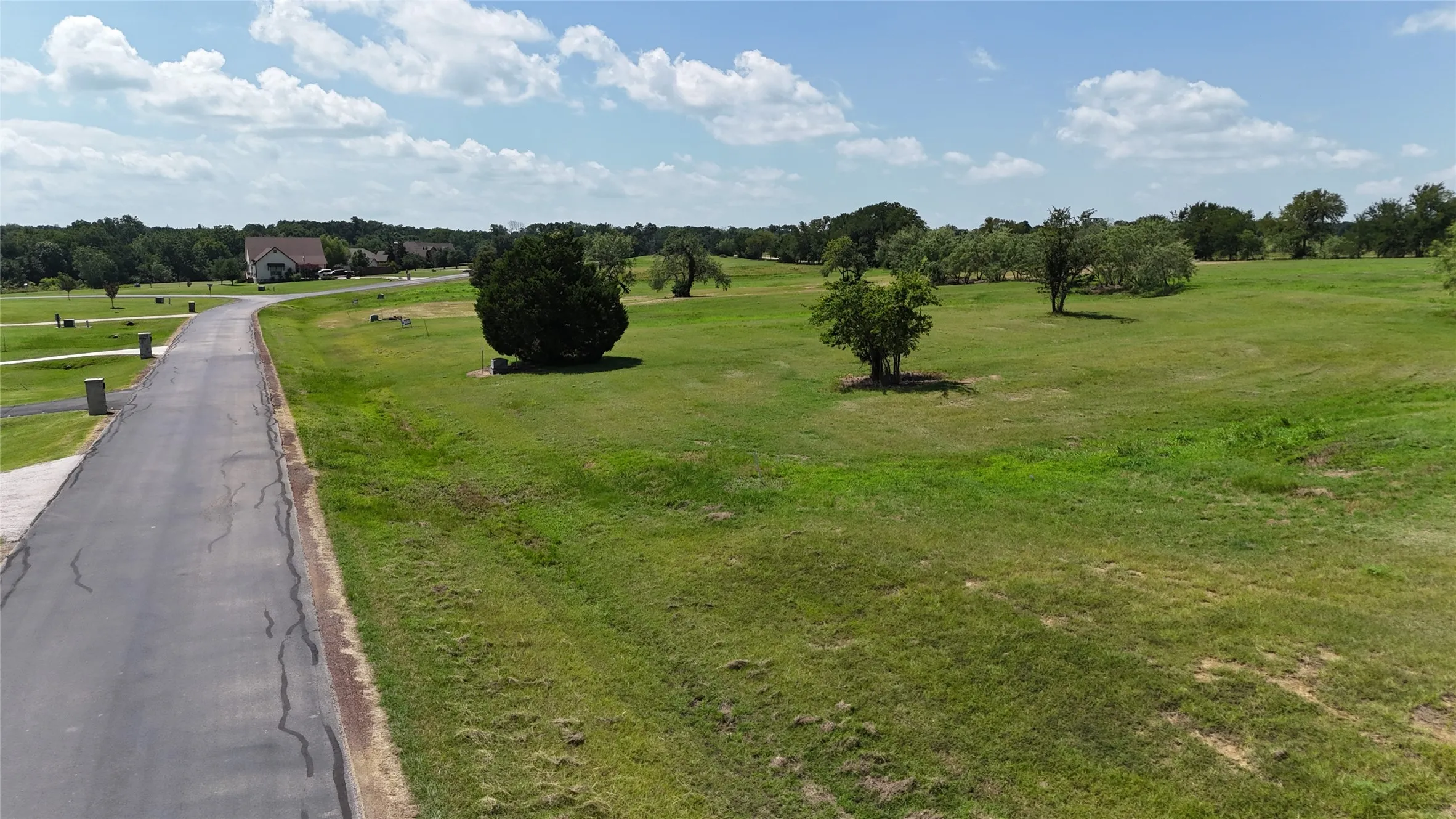 Paved private road leading to this level 1.01-acre homesite in Southpoint.